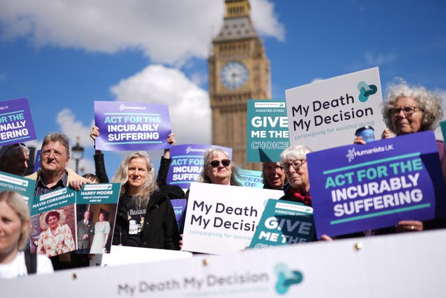 <p>Campaigners in support of voluntary euthanasia protest outside Parliament ahead of the debate among MPs</p>