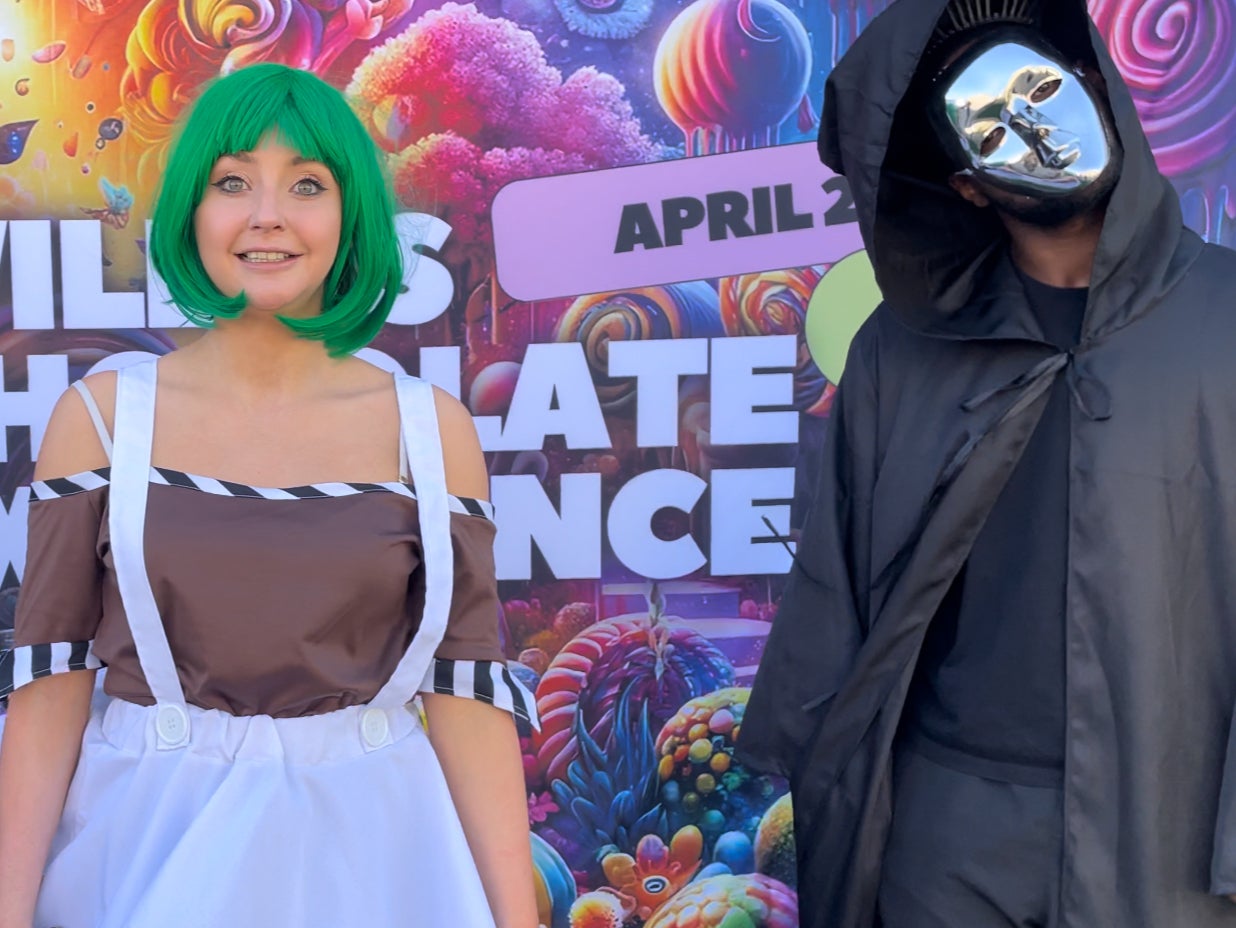 Kirsty Paterson as the sad Oompa Loompa alongside a fellow cast member playing the Unknown at the Willy Wonka Experience in Downtown Los Angeles, California on 28 April.