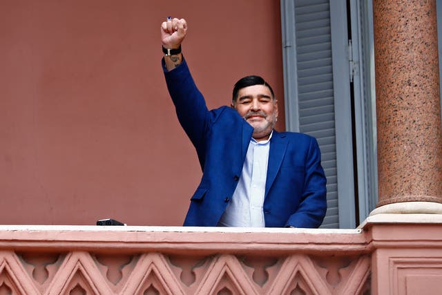 <p> Former soccer great Diego Maradona acknowledges fans below at the Casa Rosada government house </p>