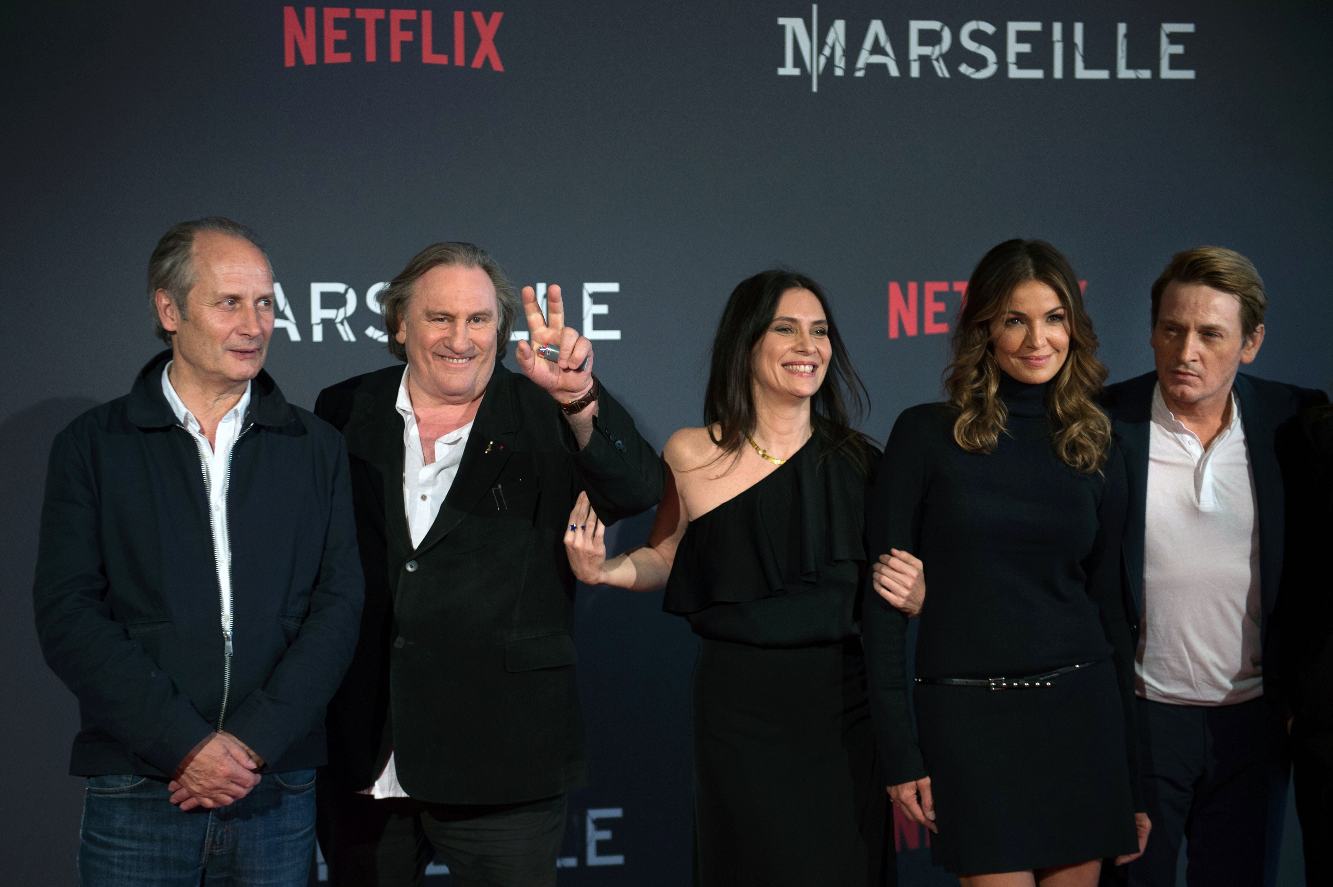 (From L) French actors Hippolyte Girardot, Gerard Depardieu, Geraldine Pailhas, Nadia Fares and Benoit Magimel pose during a photocall for the premiere of the French TV show "Marseille"