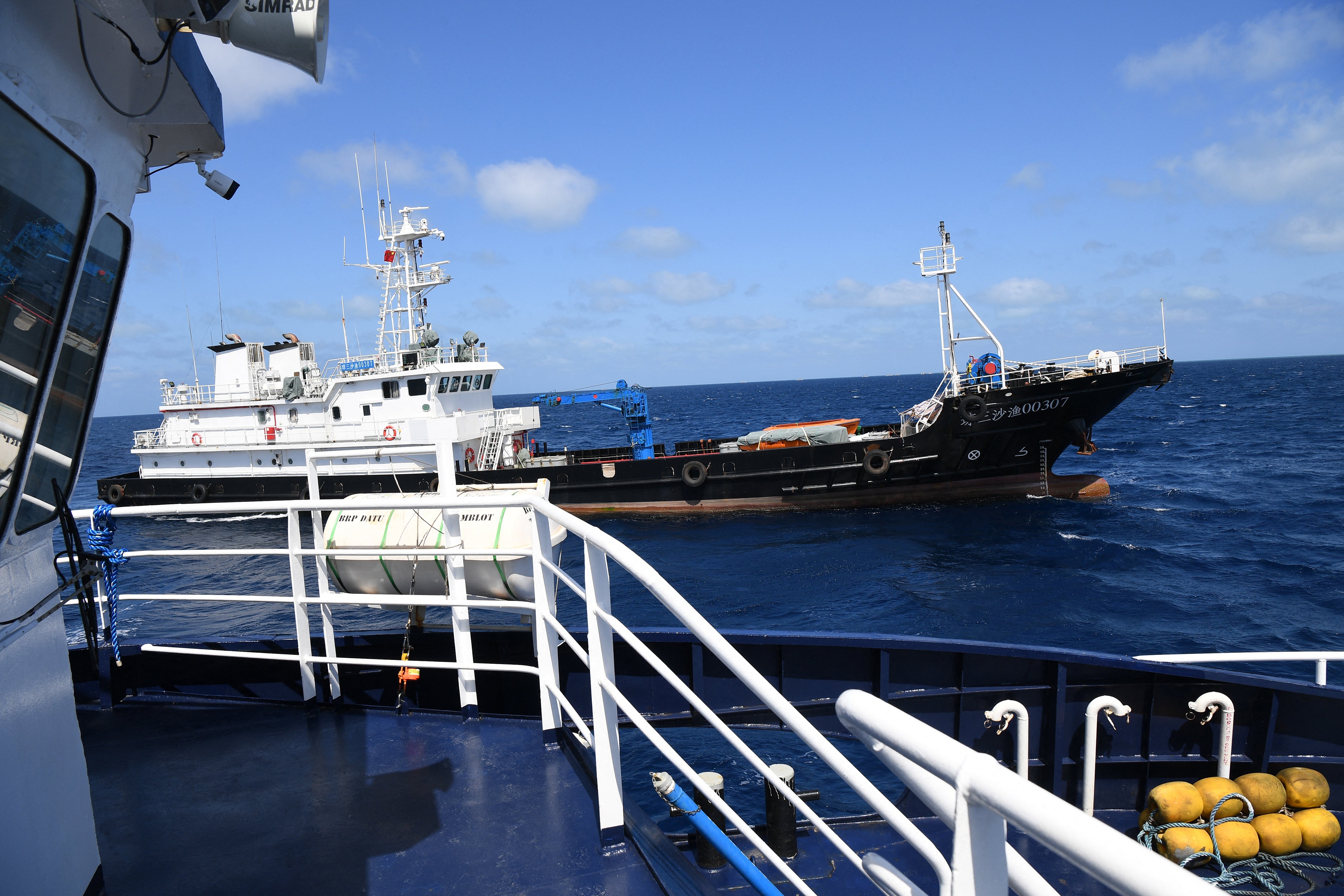 <p>File: A Chinese vessel maneouvers close to Philippine ship BRP Datu Tamblot near Scarborough Shoal in February 2024 </p>
