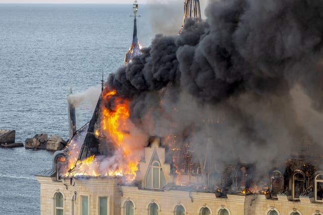 <p>A building burns in Odessa after a missile attack by Russian forces in April </p>