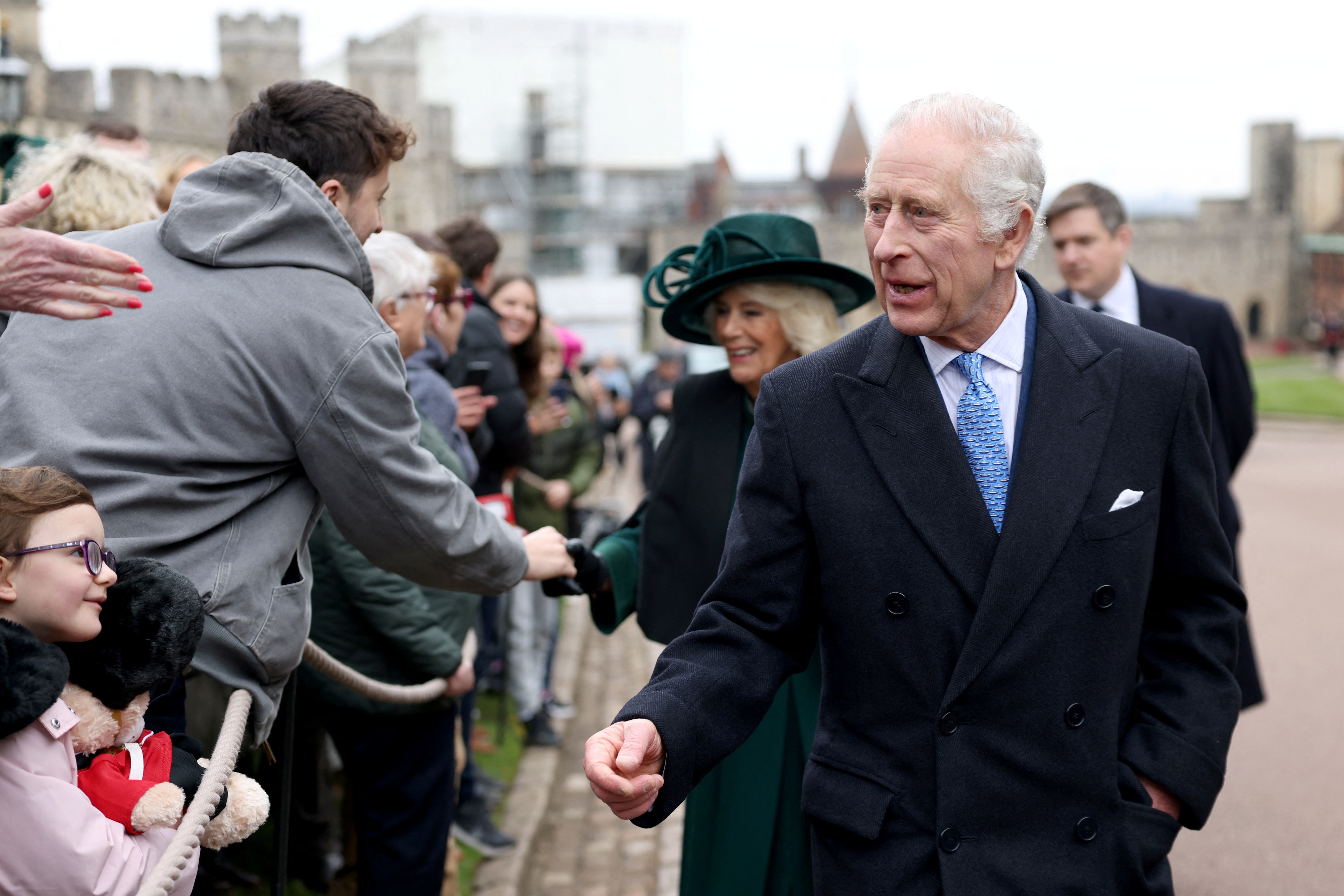 The King and Queen meet members of the public following the Easter Mattins Service at St George’s Chapel at Windsor Castle (PA)