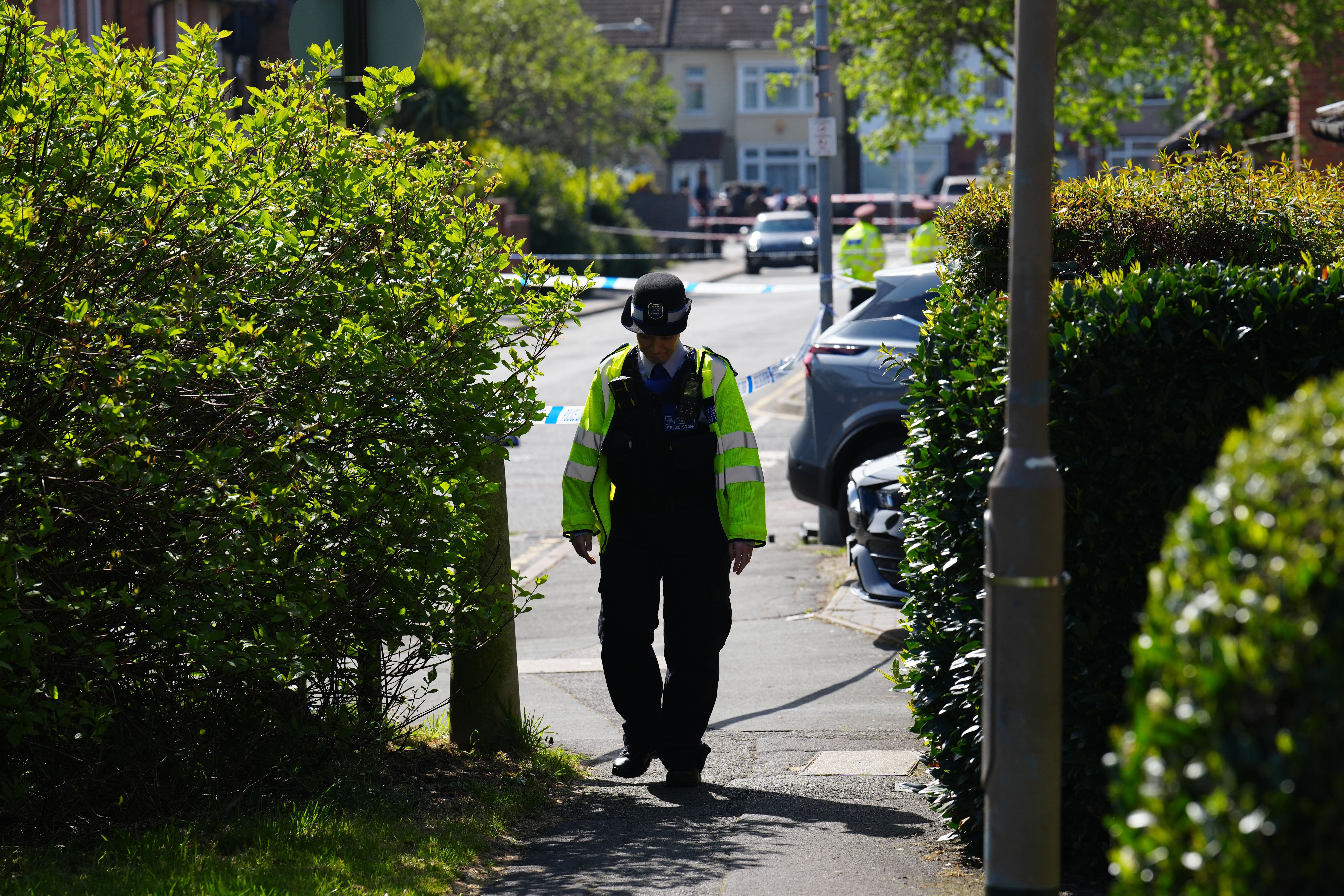 A police officer secures the scene after the sword attack