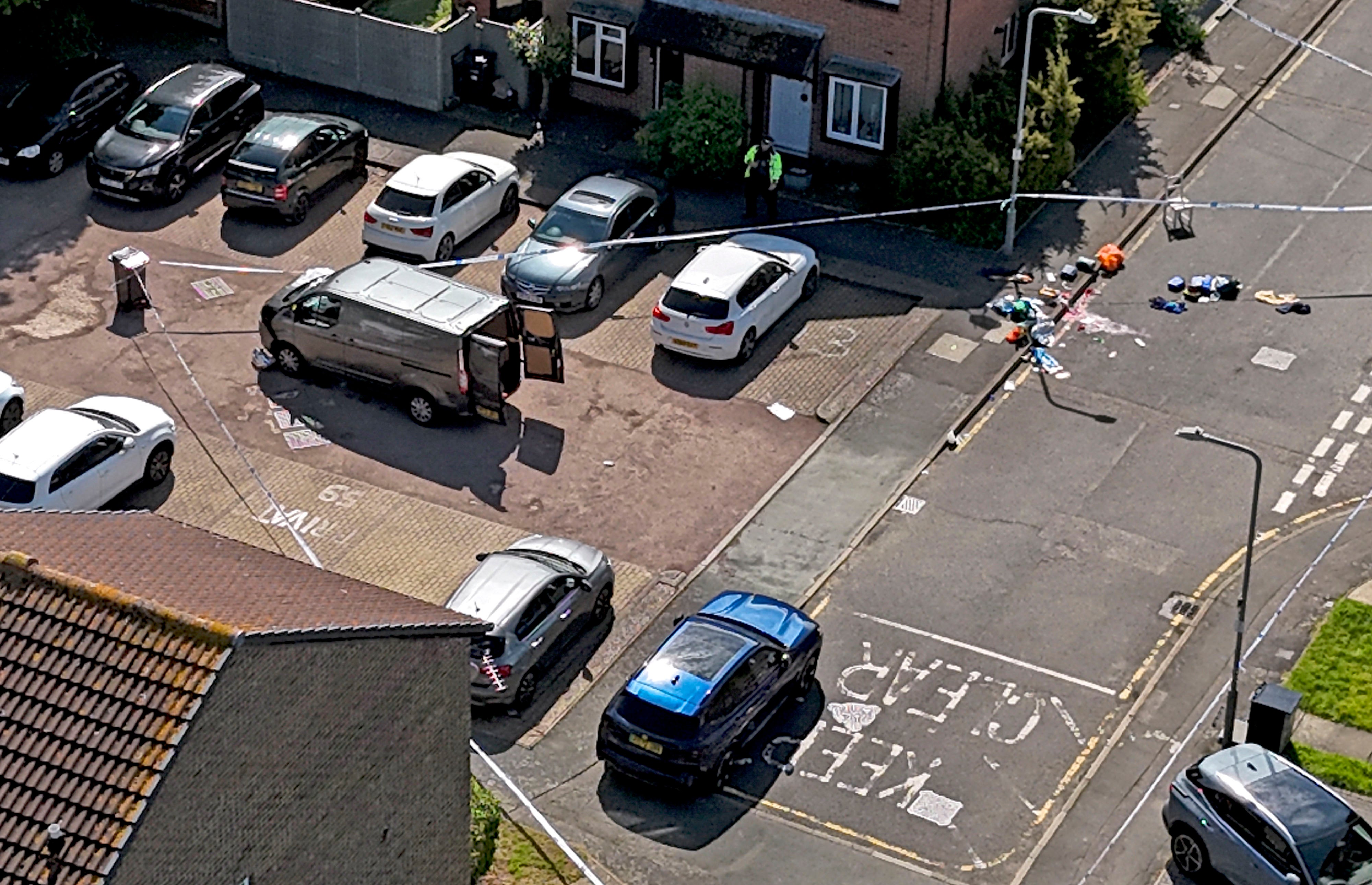 Police tape around a van on Laing Close in Hainault, east London following reported stabbings and attacks on police officers