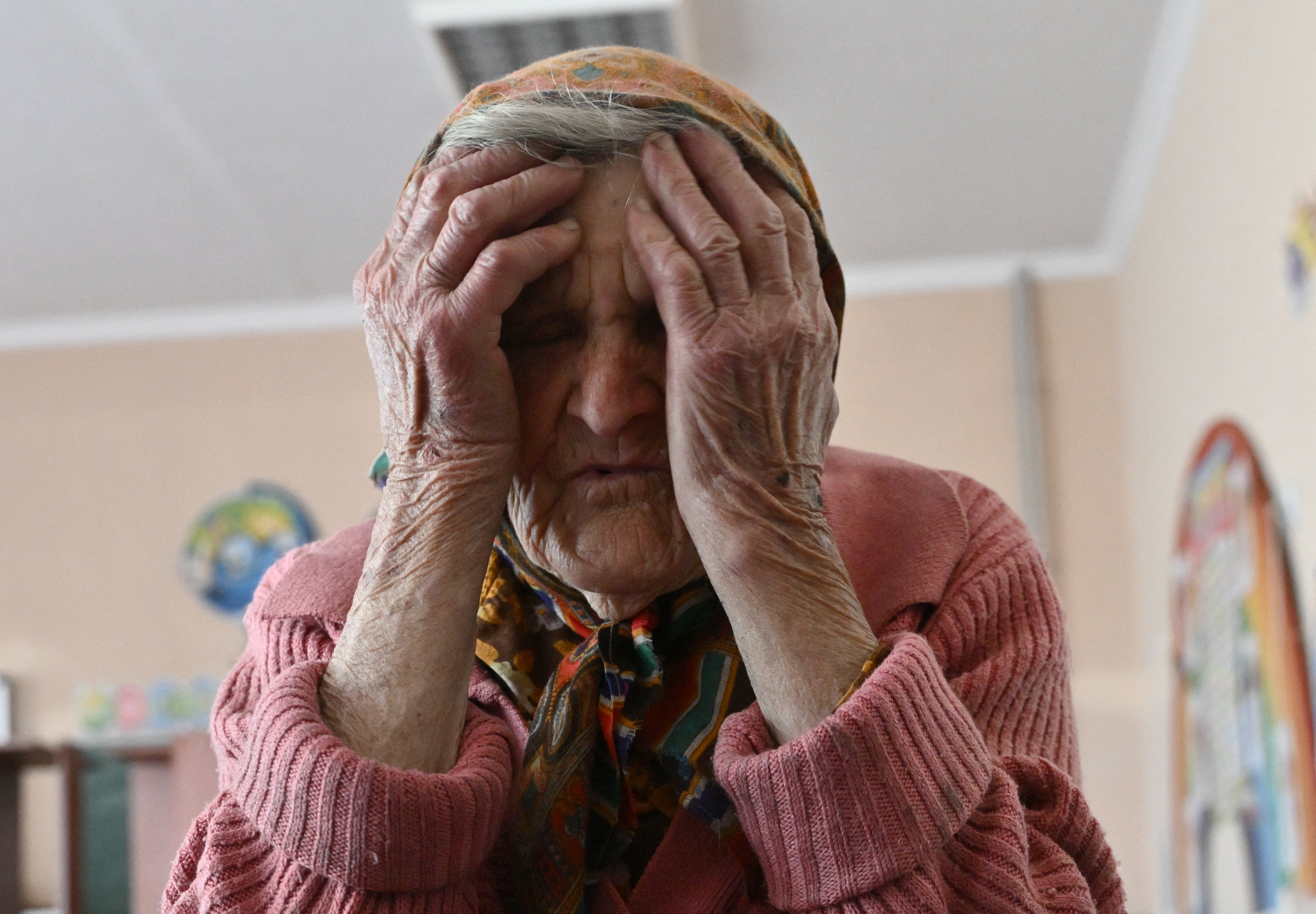 Lidia Stepanivna, 98, who fled her house in the village of Ocheretyne on foot, without taking anything with her after a bombardment, sits in a shelter in Pokrovsk, Donetsk region, on April 28, 2024