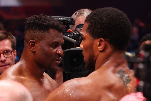<p>Anthony Joshua (right) consoling Francis Ngannou after beating him via knockout</p>