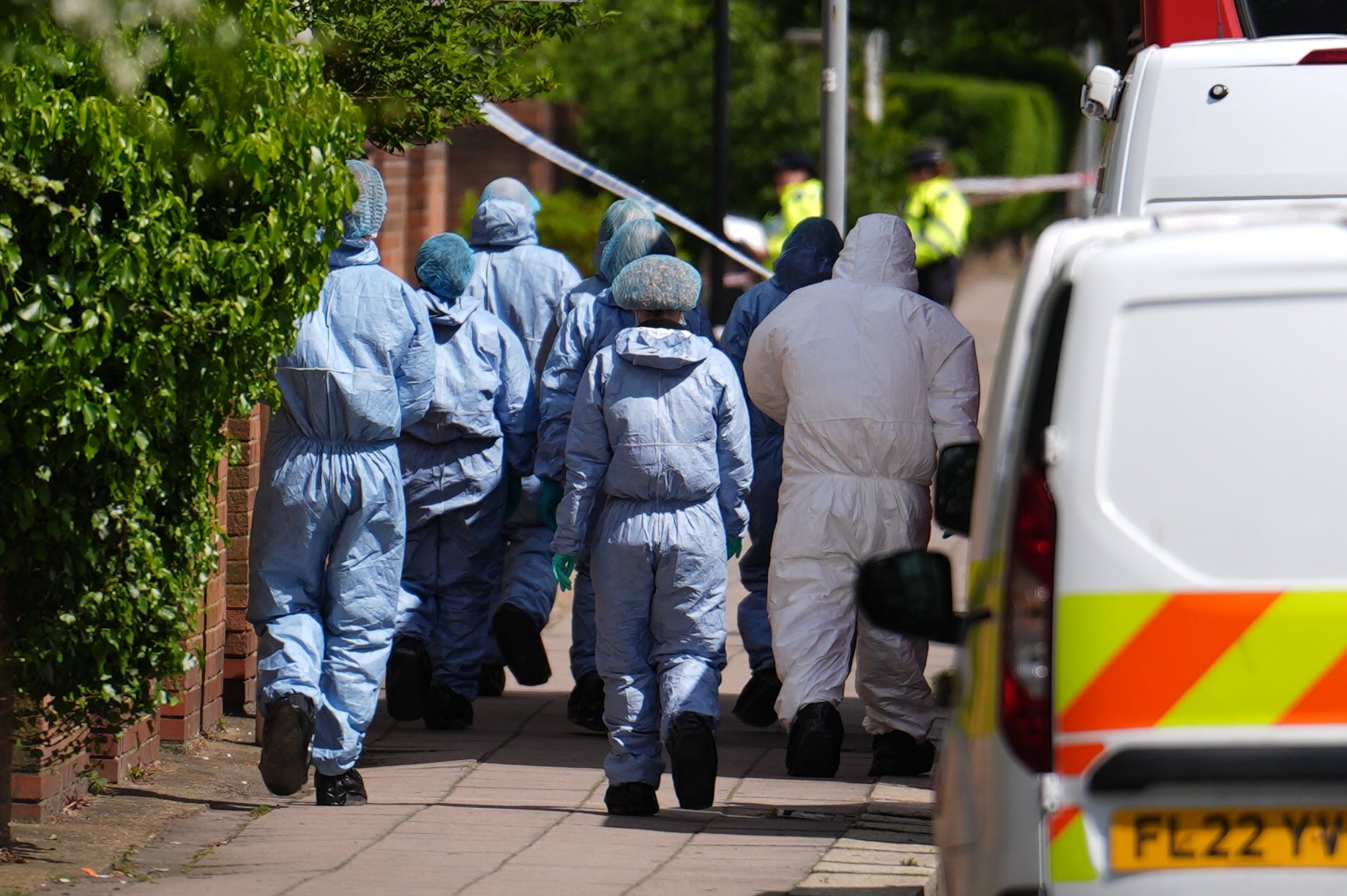 Forensic investigators at the scene in northeast London