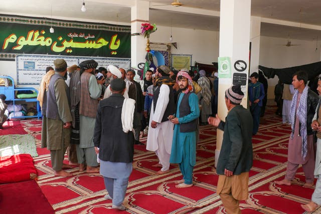 <p>Afghans gather at a mosque where gunmen attacked Shiite Muslims in Guzara district of Herat province</p>
