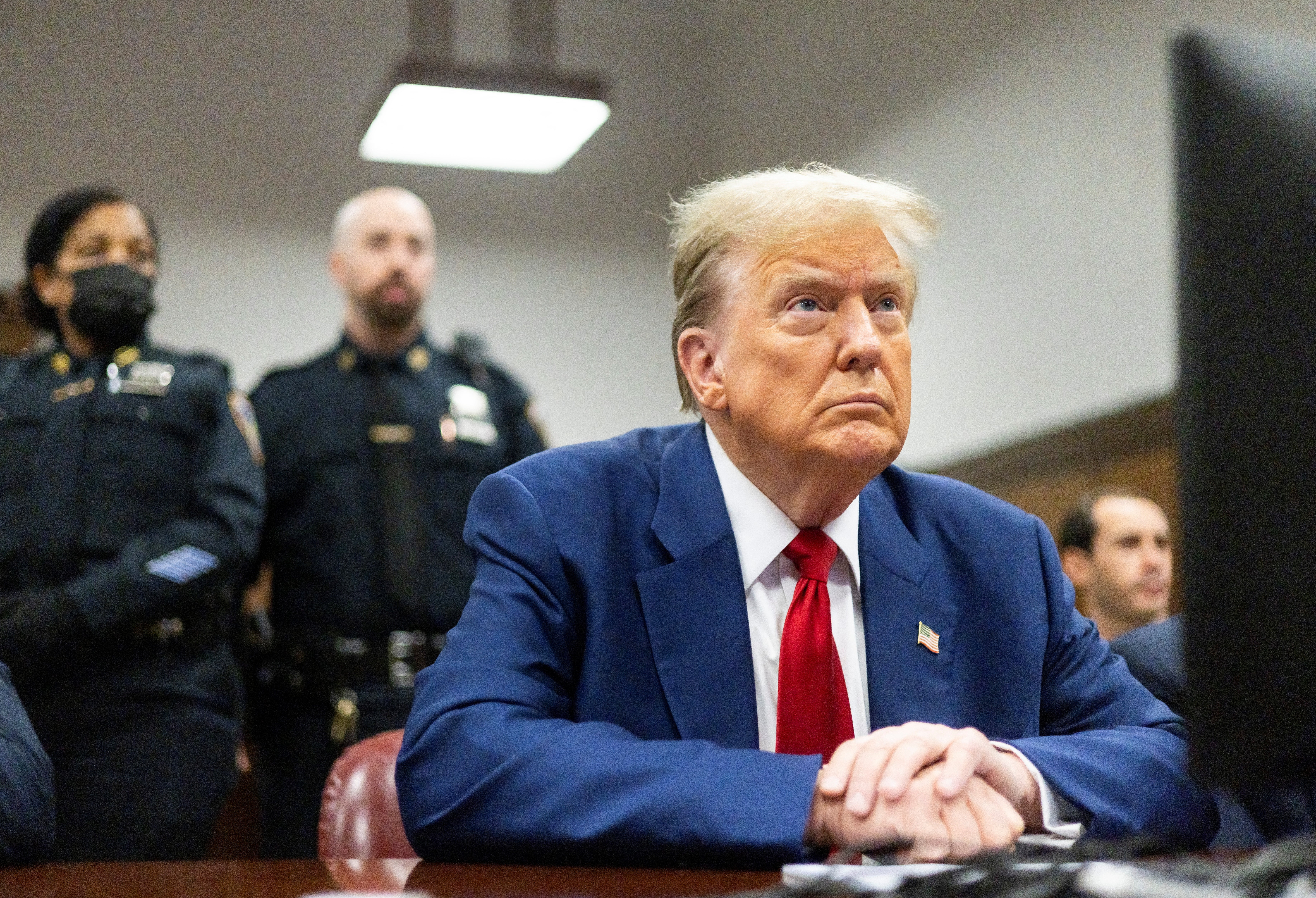 Donald Trump is seated at the defence table inside the courtroom on 30 April