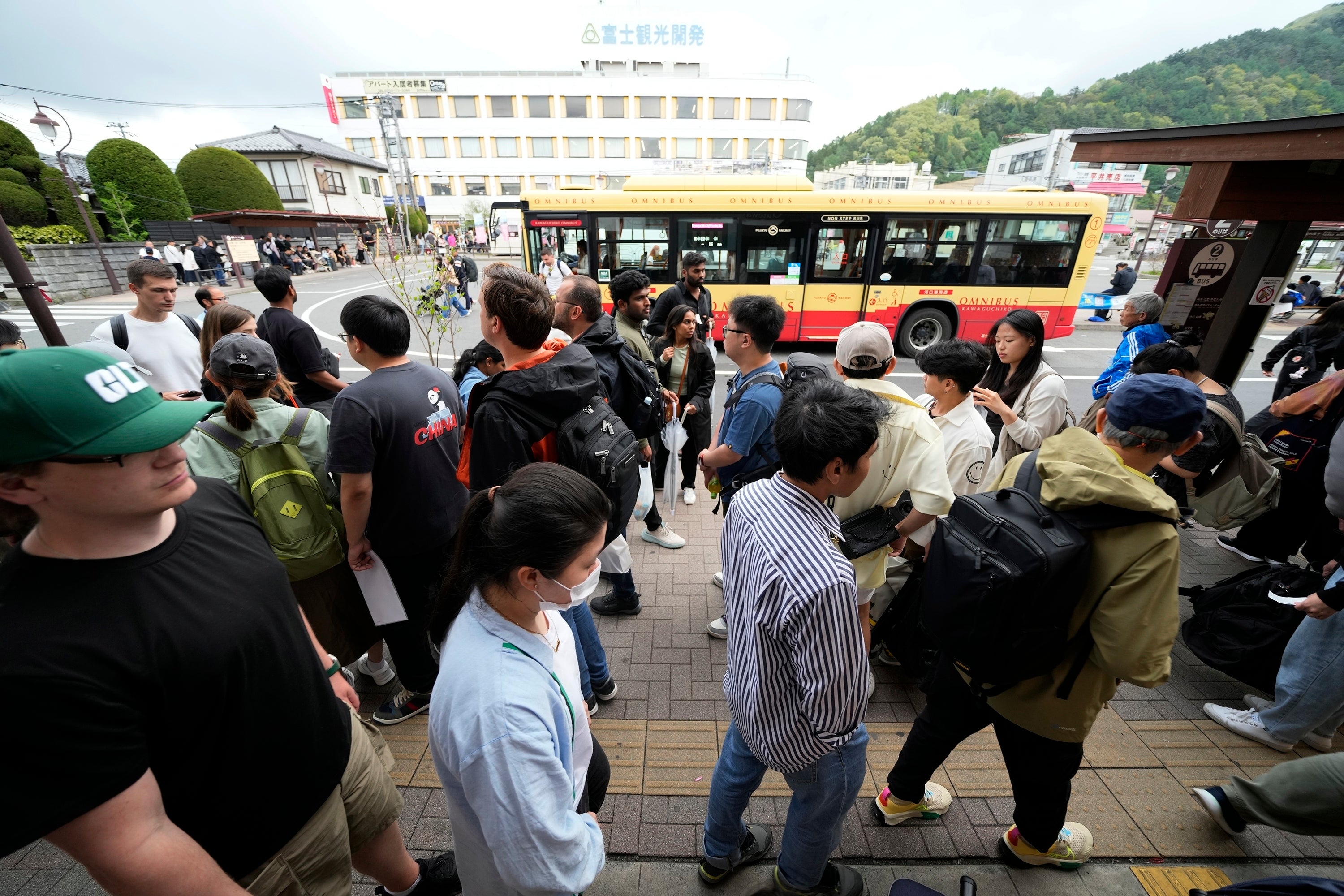 Japan Mt. Fuji Tourists are packed at a train and bus station Tuesday, April 30, 2024, at Fujikawaguchiko town, Yamanashi Prefecture