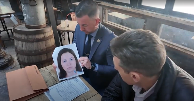 <p>Detective Ryan Glas holding a picture of ‘Midtown Jane Doe’ who has now been identified as Patricia Kathleen McGlone</p>