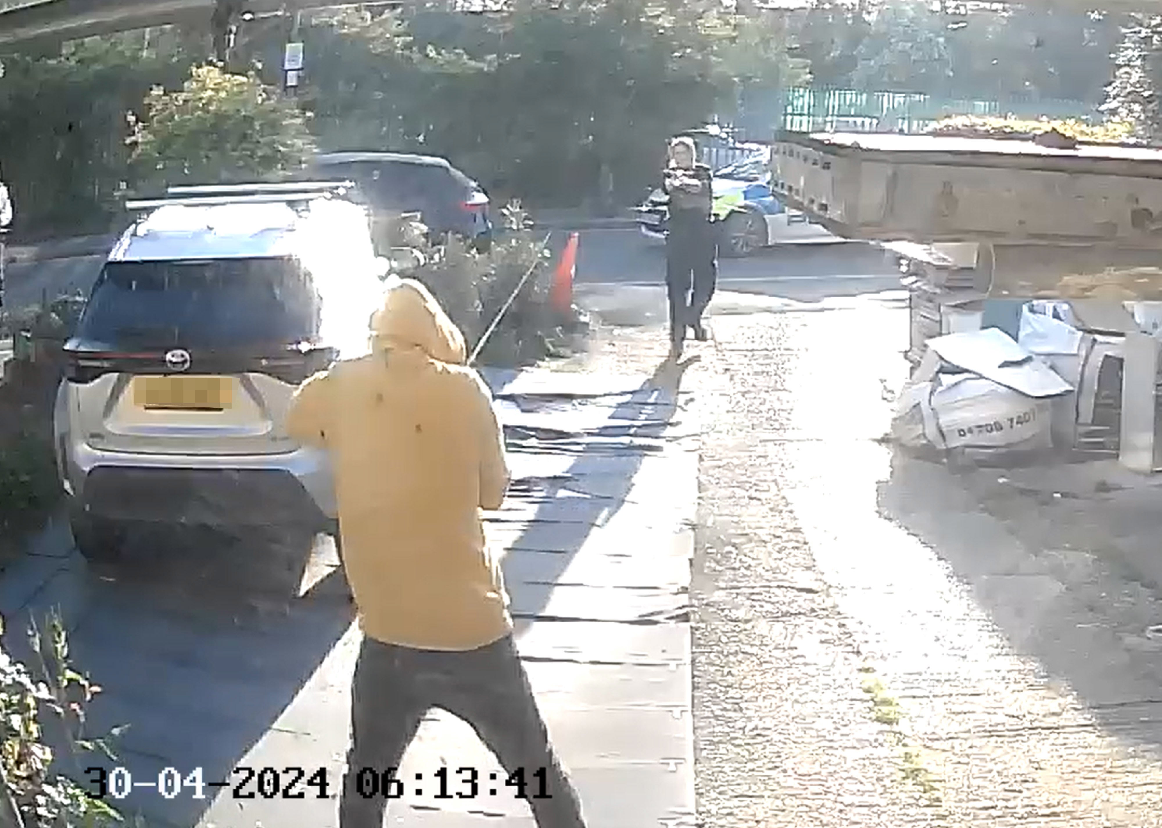 Doorbell camera footage shows police approaching the sword-wielding man in Hainault