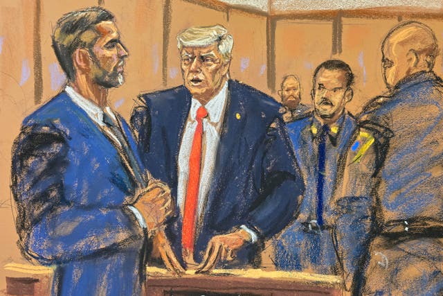 <p>Donald Trump chats with his son Eric Trump on the fifth day of testimony at his hush money trial</p>