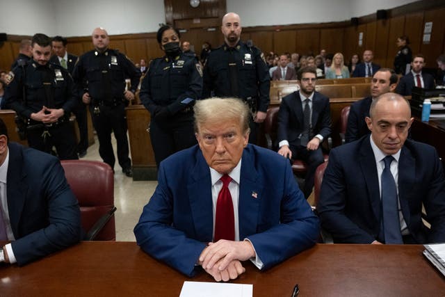 <p>Donald Trump appears with his attorney Emil Bove, right, and Todd Blanche, left, in a Manhattan criminal courtroom on 30 April. </p>