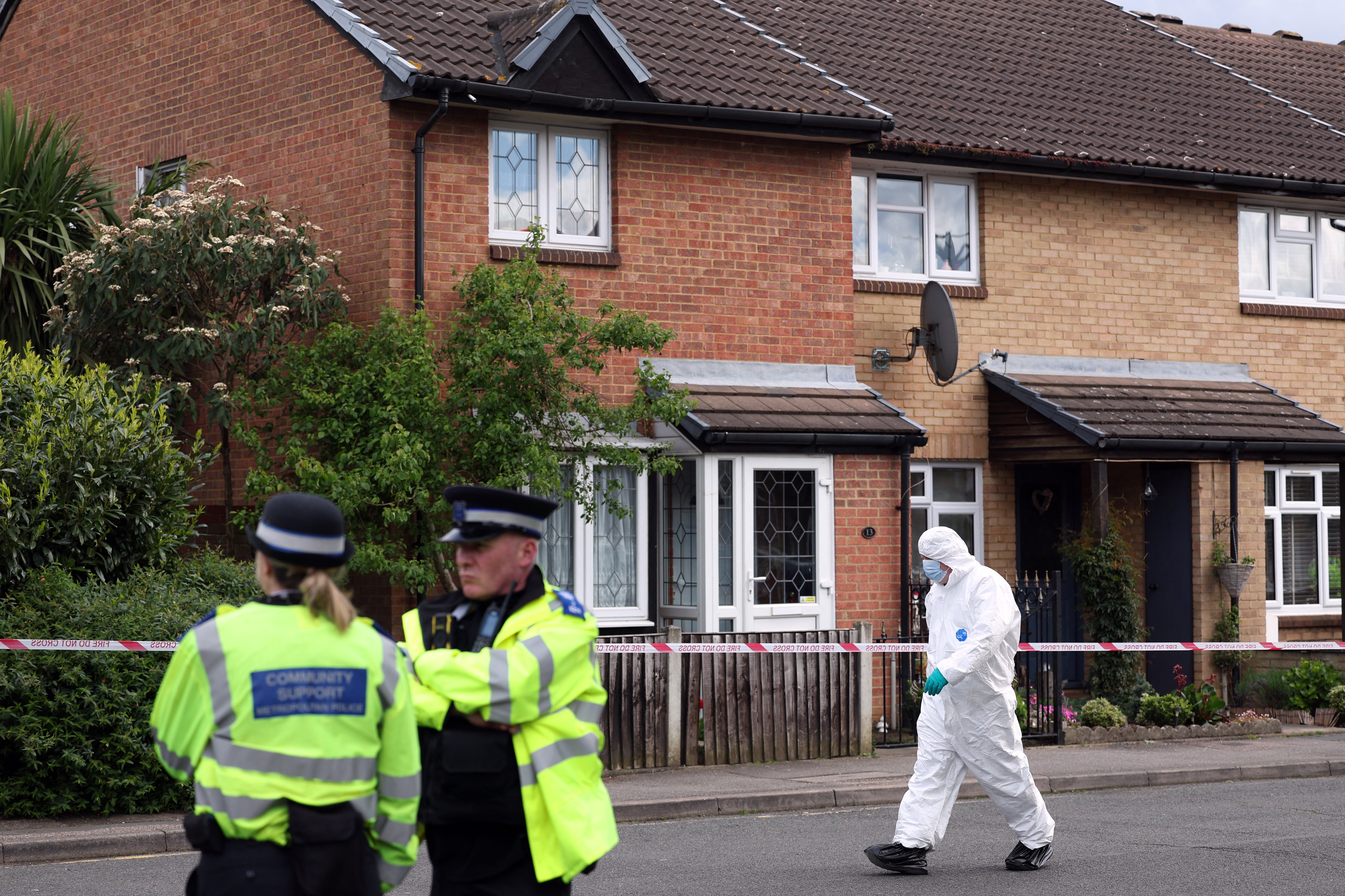 Police and forensics teams outside a property in Hainault