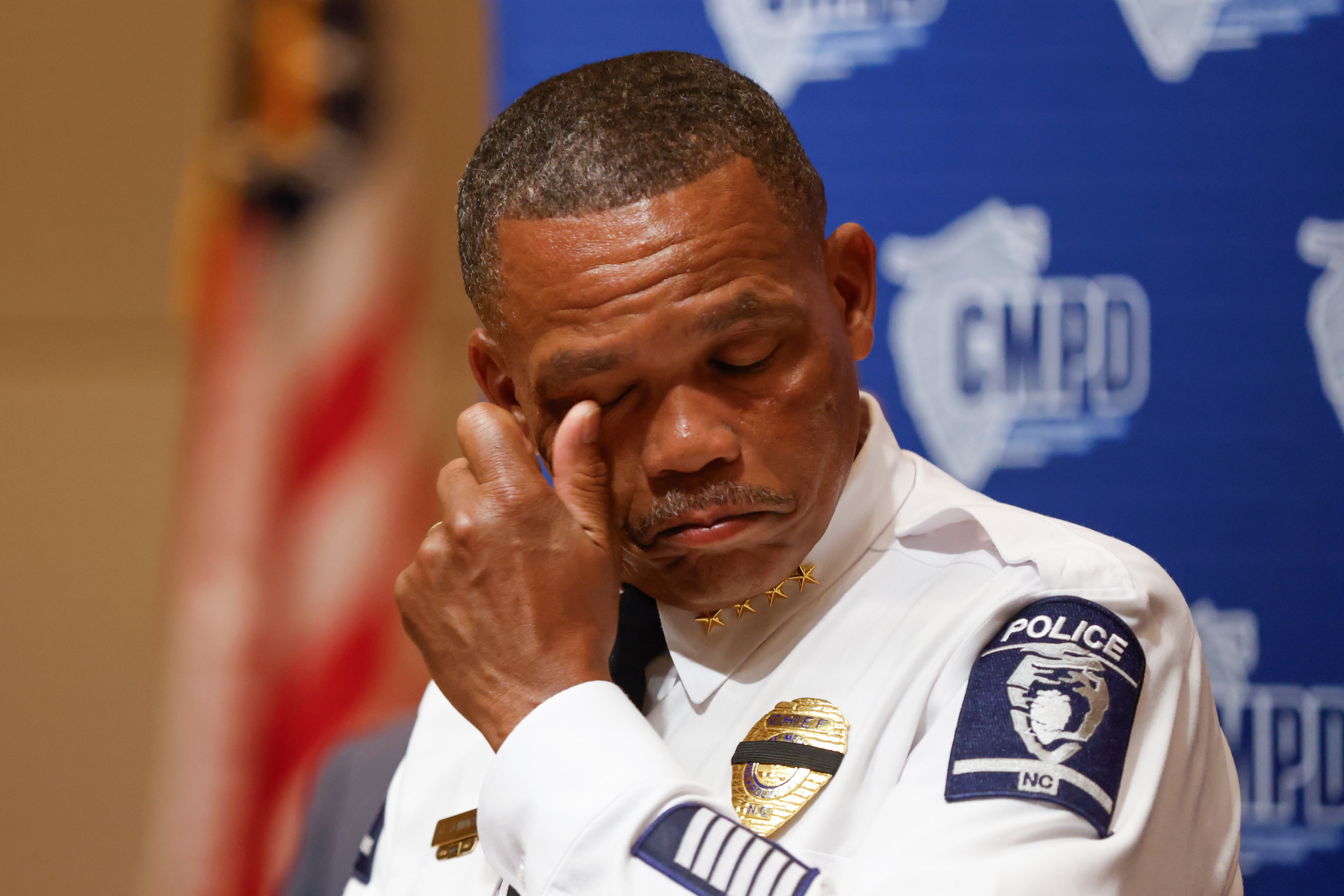 Police Chief Johnny Jennings wipes away tears as he speaks at a press conference on Tuesday