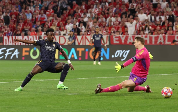 Vinicius Jr broke in behind before slipping the ball past Manuel Neuer