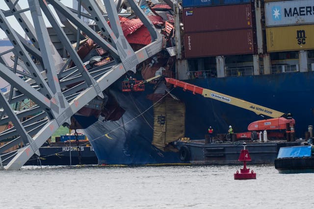 <p>Workers remove wreckage of the collapsed Francis Scott Key Bridge, Thursday, April 25, 2024</p>