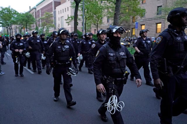 NYPD officers arrive near Columbia University where pro-Palestinian students are barricaded inside a building and have set up an encampment, in New York City on April 30, 2024
