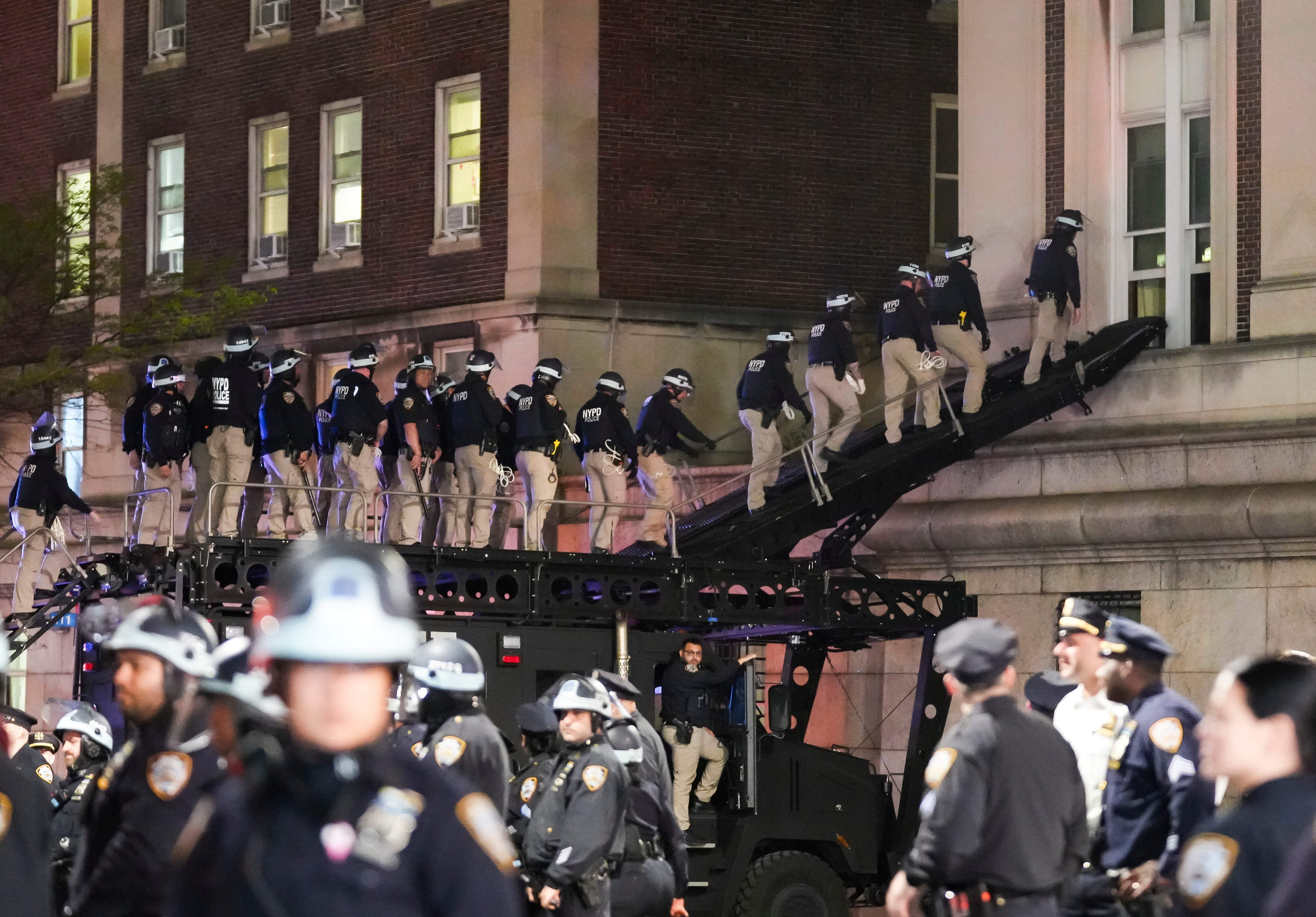 NYPD officers use a tactical ramp to break into Hamilton Hall, which had been renamed Hind Hall by protesters occupying the building
