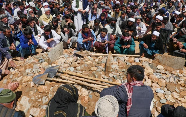 <p>Afghans mourn at a burial ceremony of the slain Shiite Muslims after gunmen attacked a mosque in Guzara district of Herat province</p>