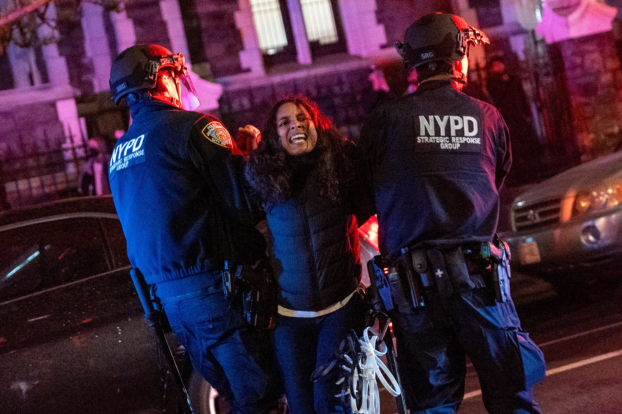 Police arrest a protester during demonstrations at The City College Of New York