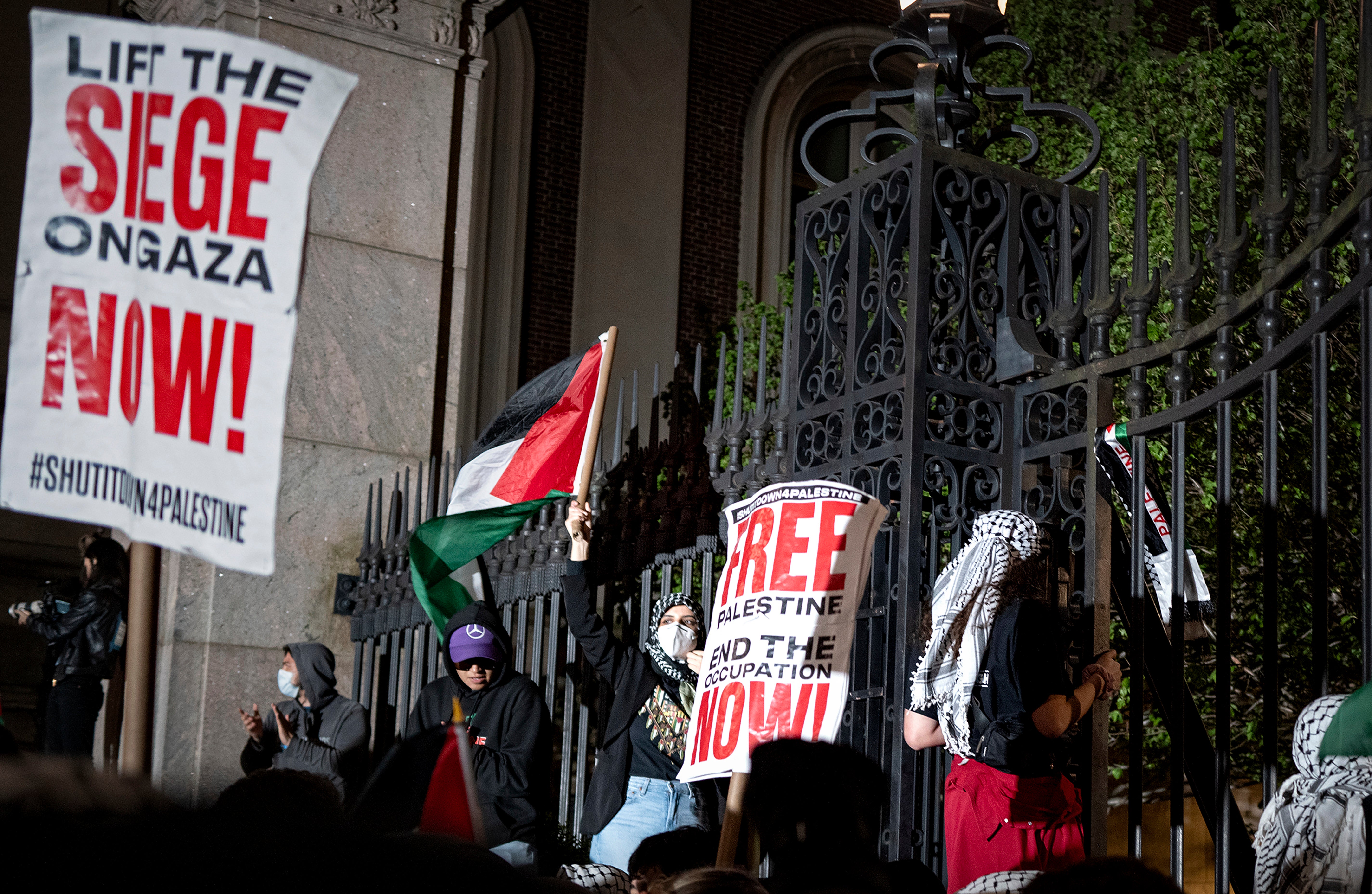 Pro-Palestianian protesters gather near a main gate at Columbia University in New York, Tuesday, April 30, 2024