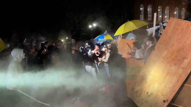 <p>Pro-Israel counter-protesters tear down UCLA encampment barriers.</p>