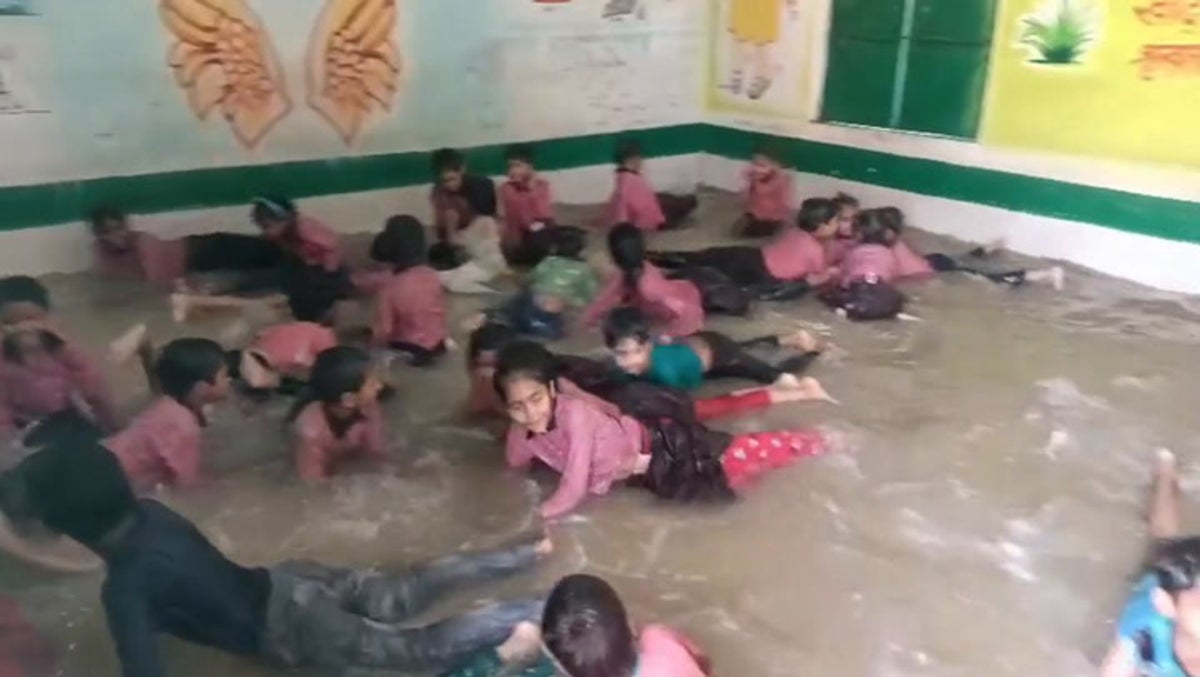 Classroom converted into swimming pool during India heatwave