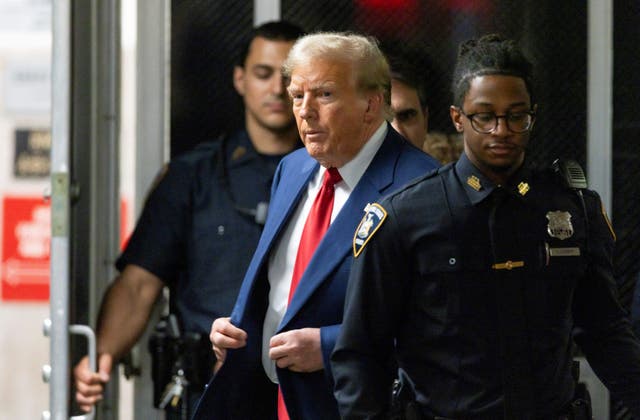 <p>Former US president Donald Trump walks out to speak to the press during his trial for allegedly covering up hush money payments linked to extramarital affairs, at Manhattan Criminal Court in New York on April 30, 2024</p>
