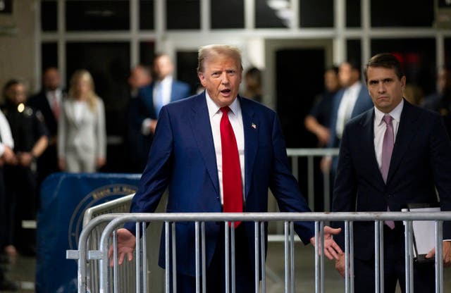 <p>Donald Trump speaks to reporters in criminal court in Manhattan on 30 April </p>
