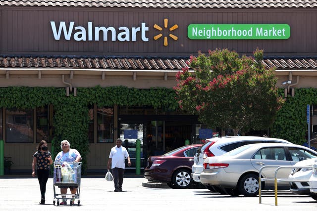 <p>Customers leave a Walmart Neighborhood Market on August 04, 2022 in Rohnert Park, California.</p>