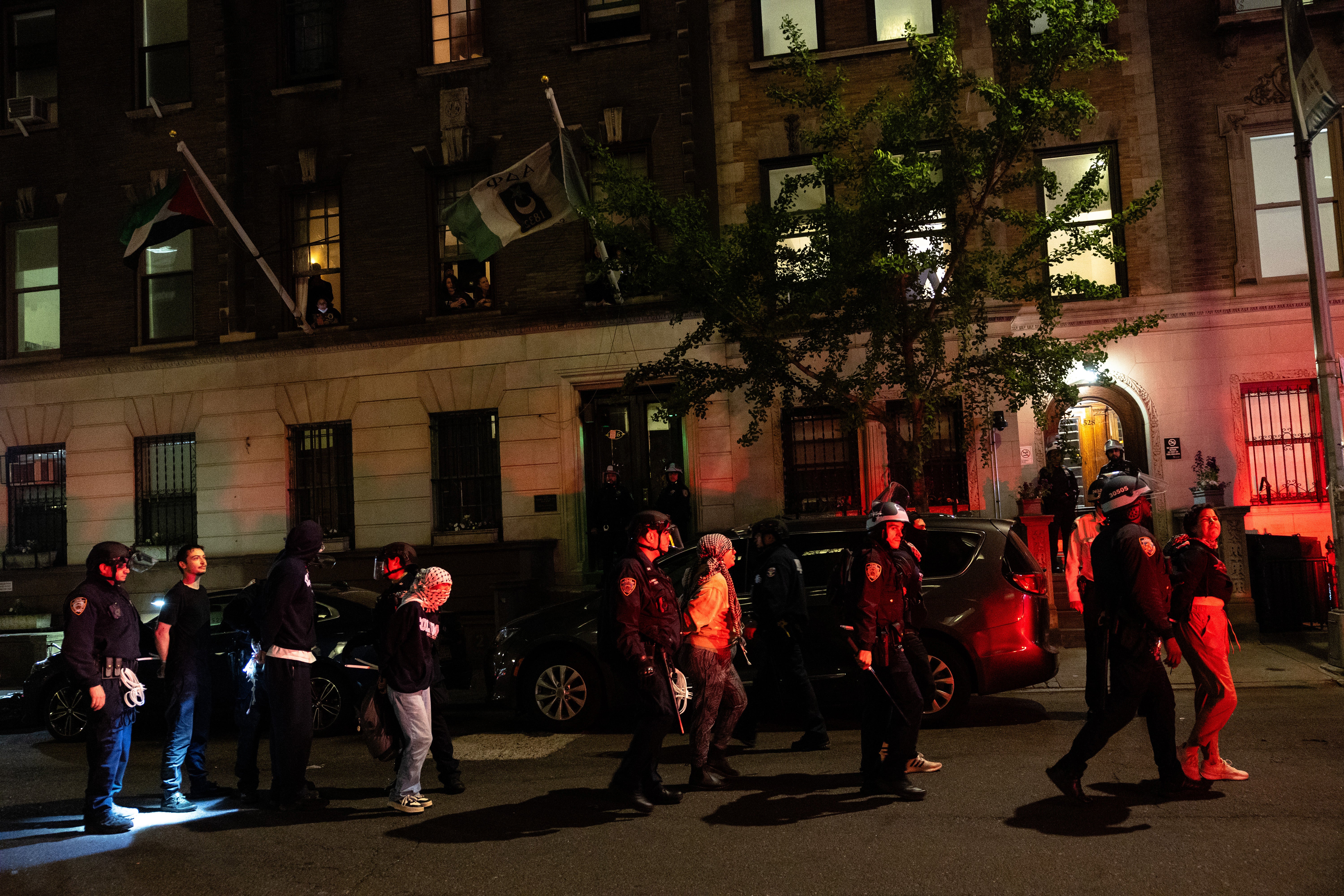 NYPD officers arrest pro-Palestinian demonstrators at Columbia University on Tuesday night. They arrested 109 people on the Ivy League campus after protesters barricaded themselves inside Hamilton Hall on Monday