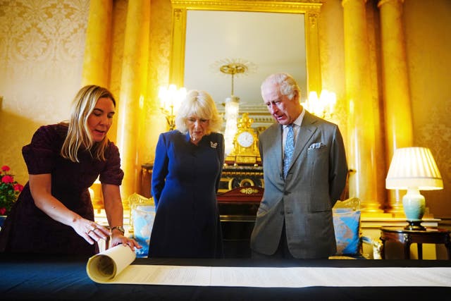 <p>King Charles III and Queen Camilla are presented with the Coronation Roll, an official record of their Coronation</p>