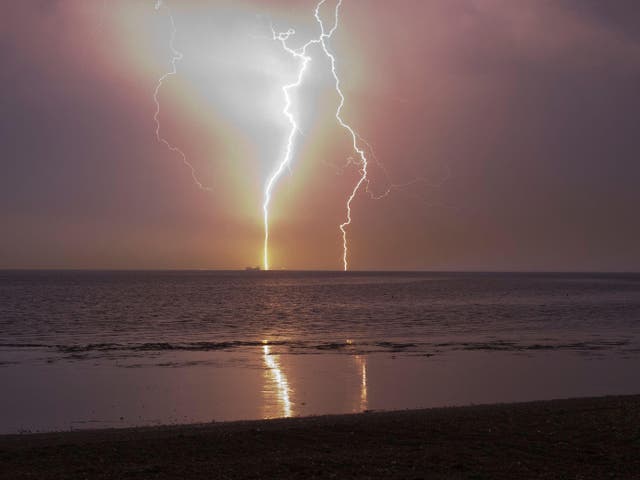 <p>Lightning seen from Minster on Sea in Kent during a thunderstorm in the early hours of Thursday </p>