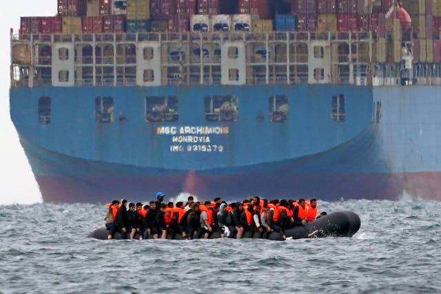 A group of people thought to be migrants crossing the Channel in a small boat (Gareth Fuller/PA)