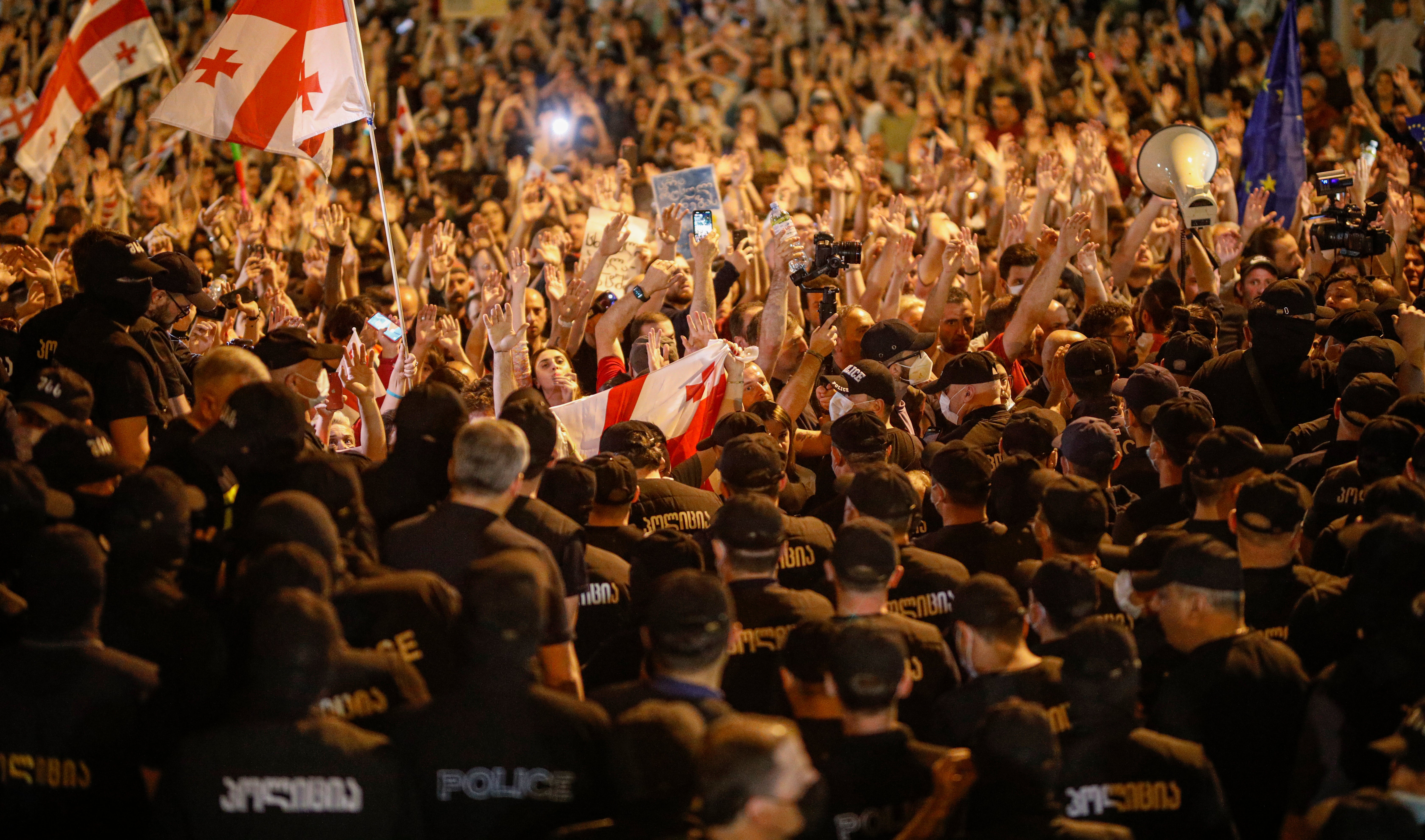 Police block protests outside the Georgia parliament in Tbilisi early on Thursday