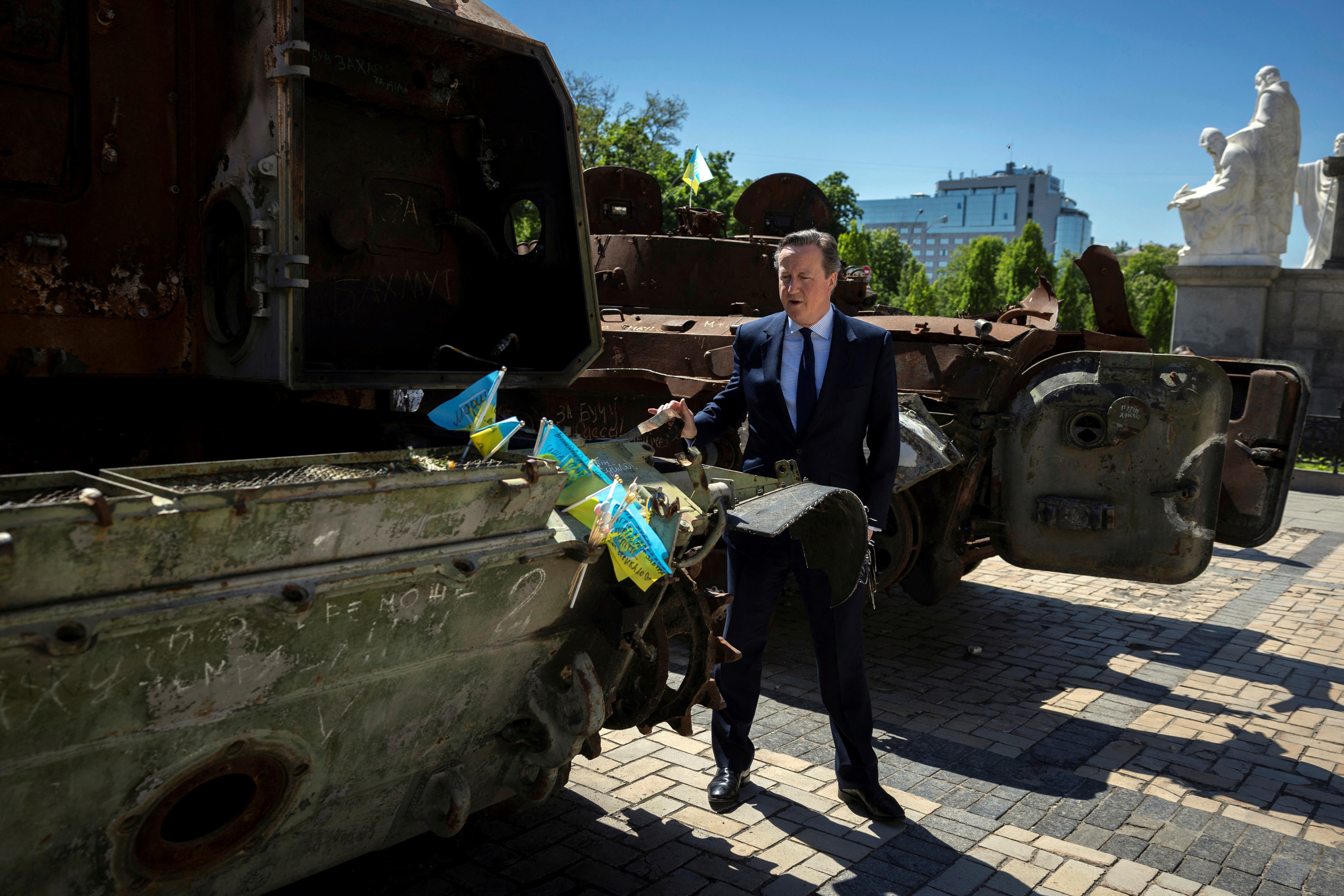 Foreign Secretary Lord David Cameron walks past a display of destroyed Russian military vehicles in Saint Michael’s Square, in Kyiv (Thomas Peter/Pool via AP)