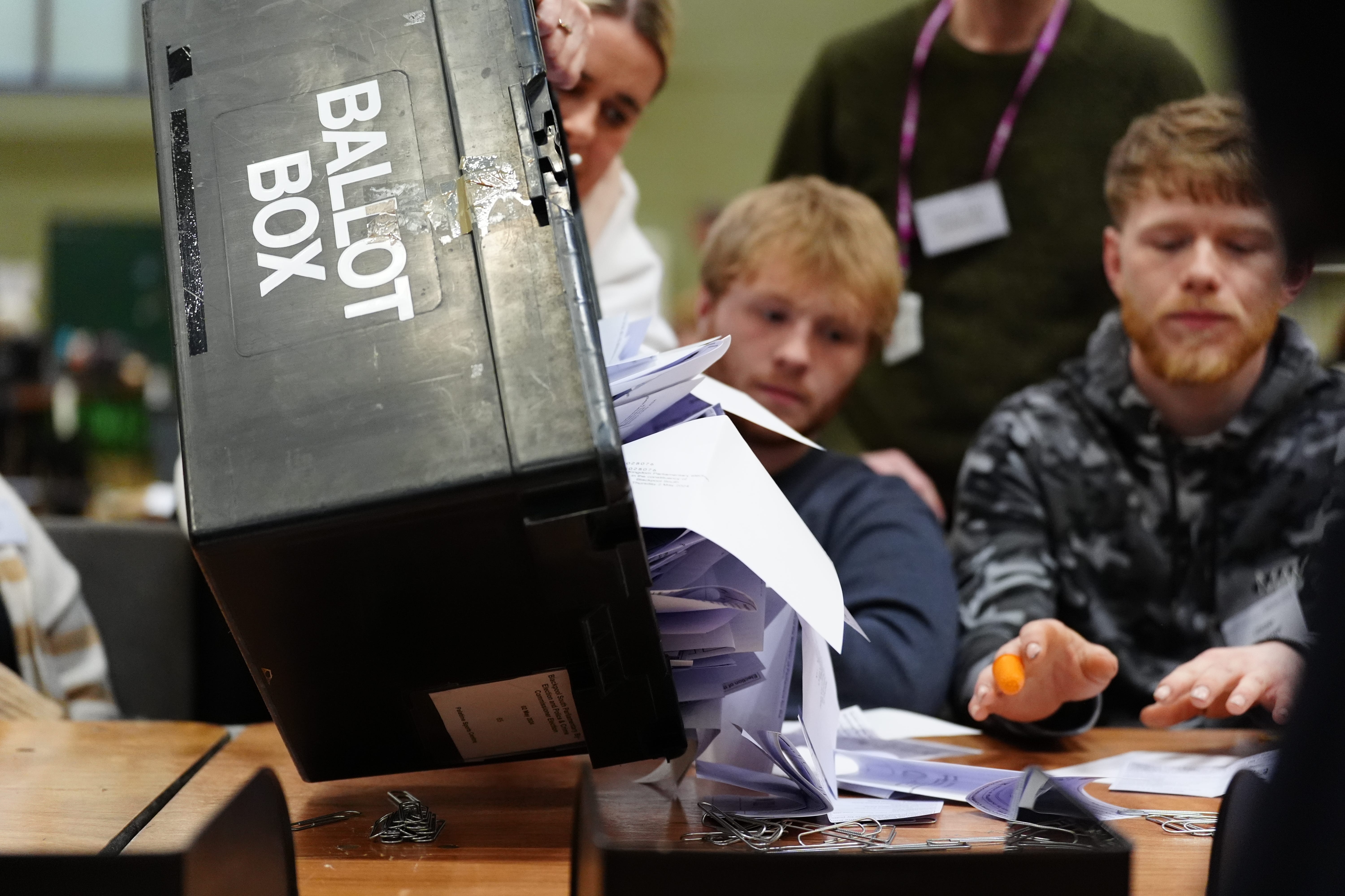 A ballot box is emptied during the count for the Blackpool South by-election at Blackpool Sports Centre (Peter Byrne/PA)