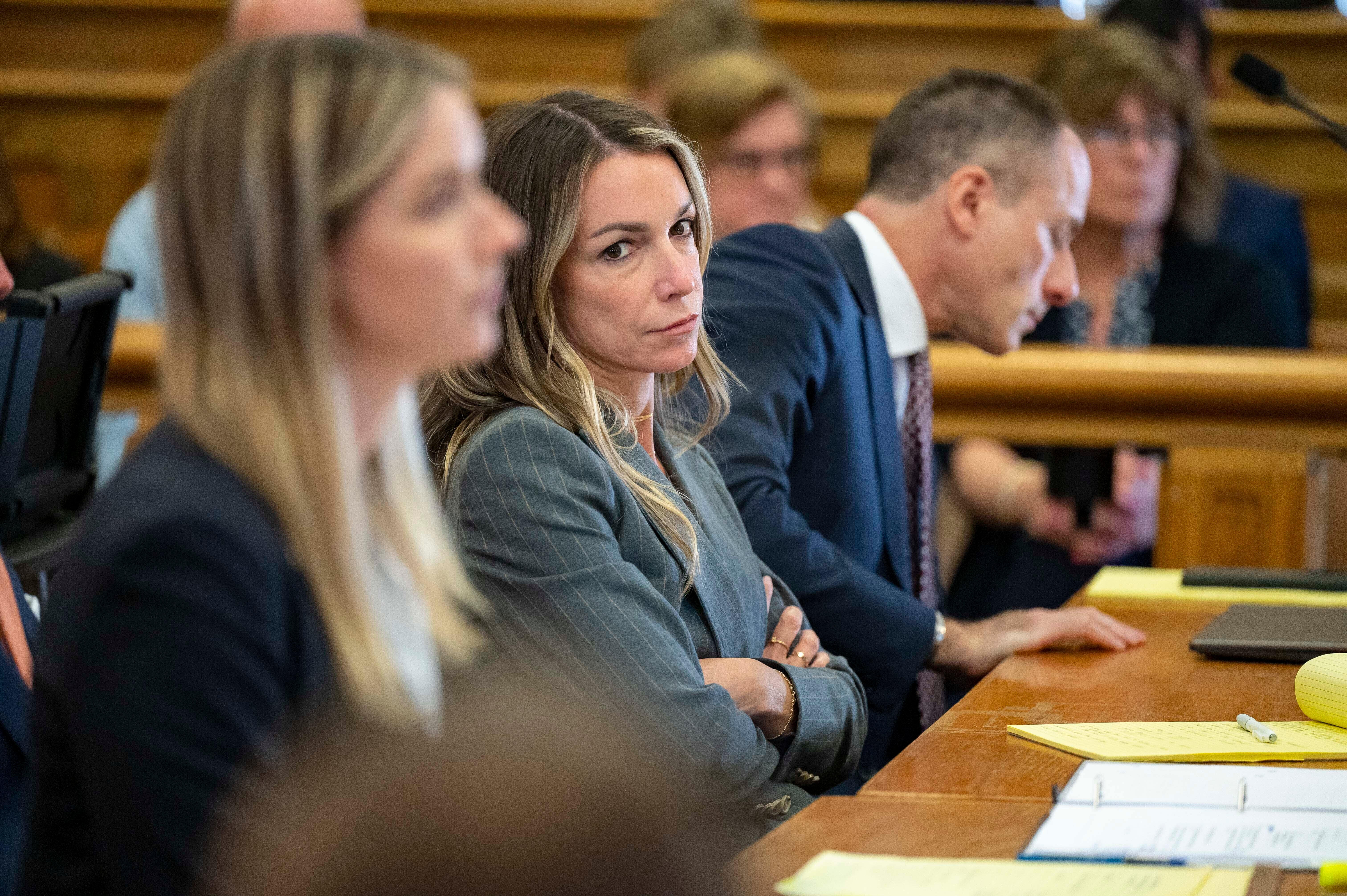 Karen Read sits with her legal team team in court Thursday, May 2, 2024, in Dedham, Mass