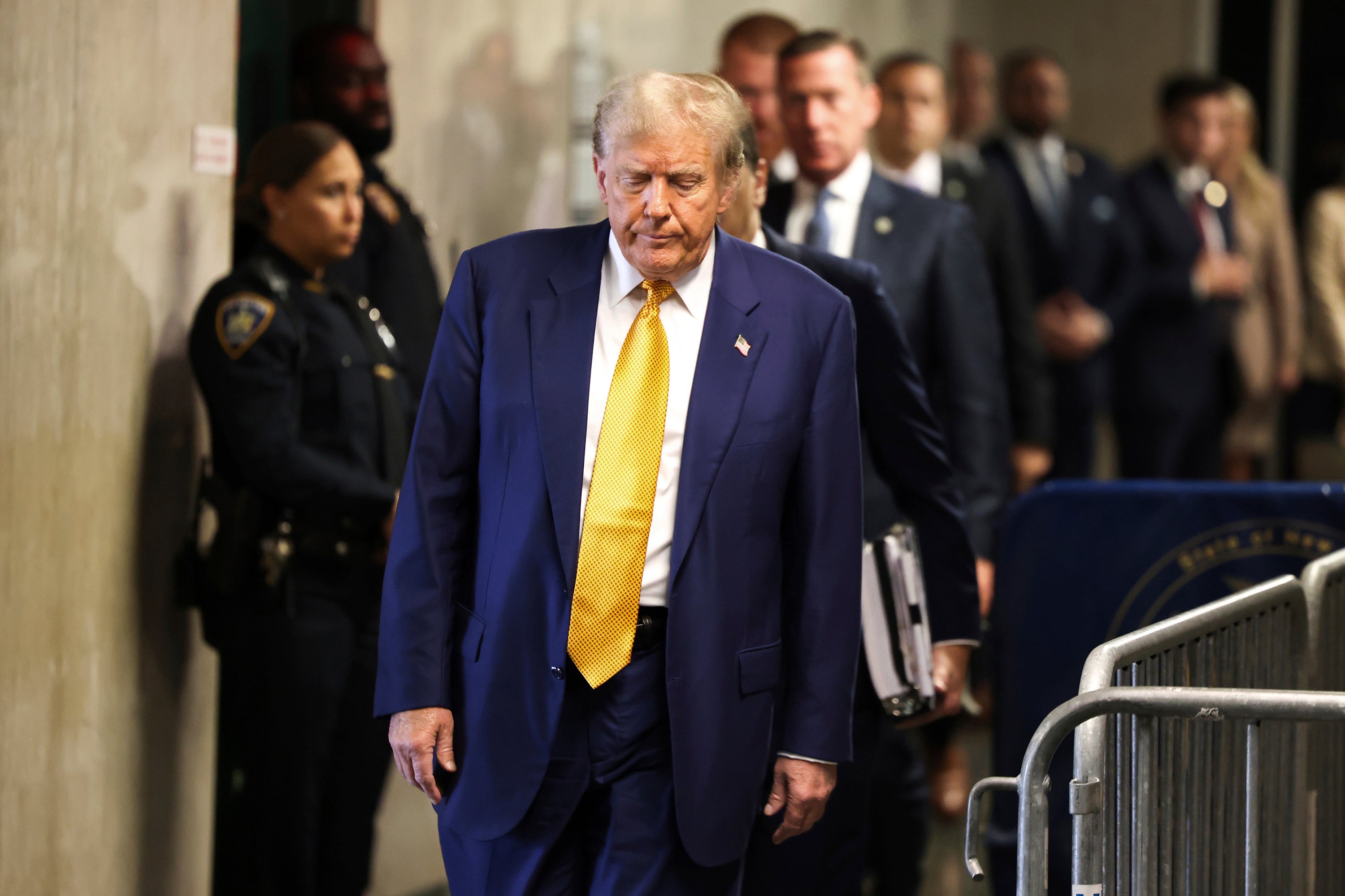 Former president Donald Trump arrives at Manhattan criminal court before his trial in New York on Thursday