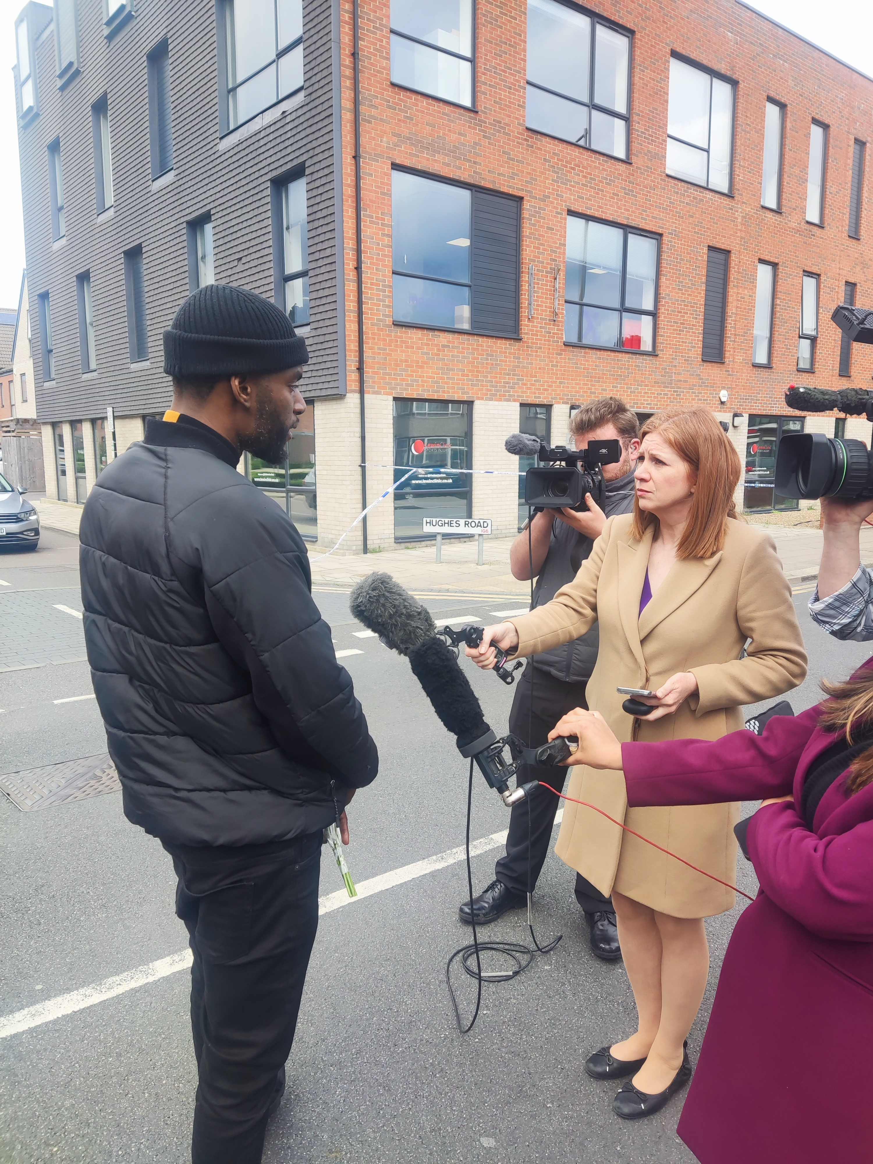 Faron Paul speaking to reporters at the scene of the Hainault attack