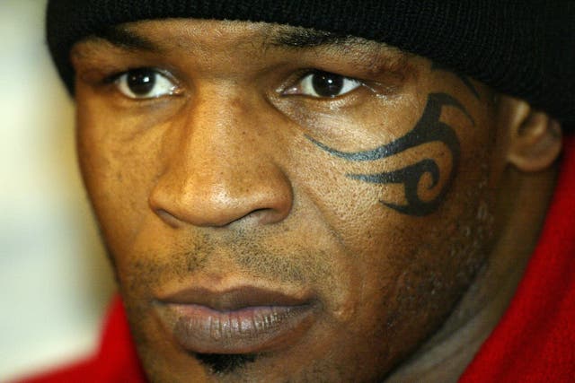 <p>Mike Tyson after his fight with Clifford Etienne in 2003</p>