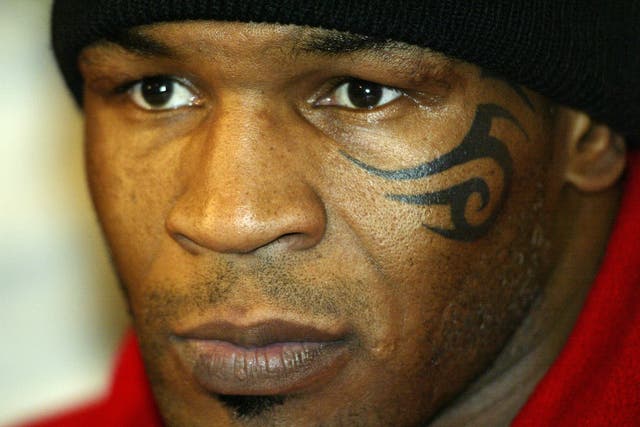 <p>Mike Tyson after his fight with Clifford Etienne in 2003</p>