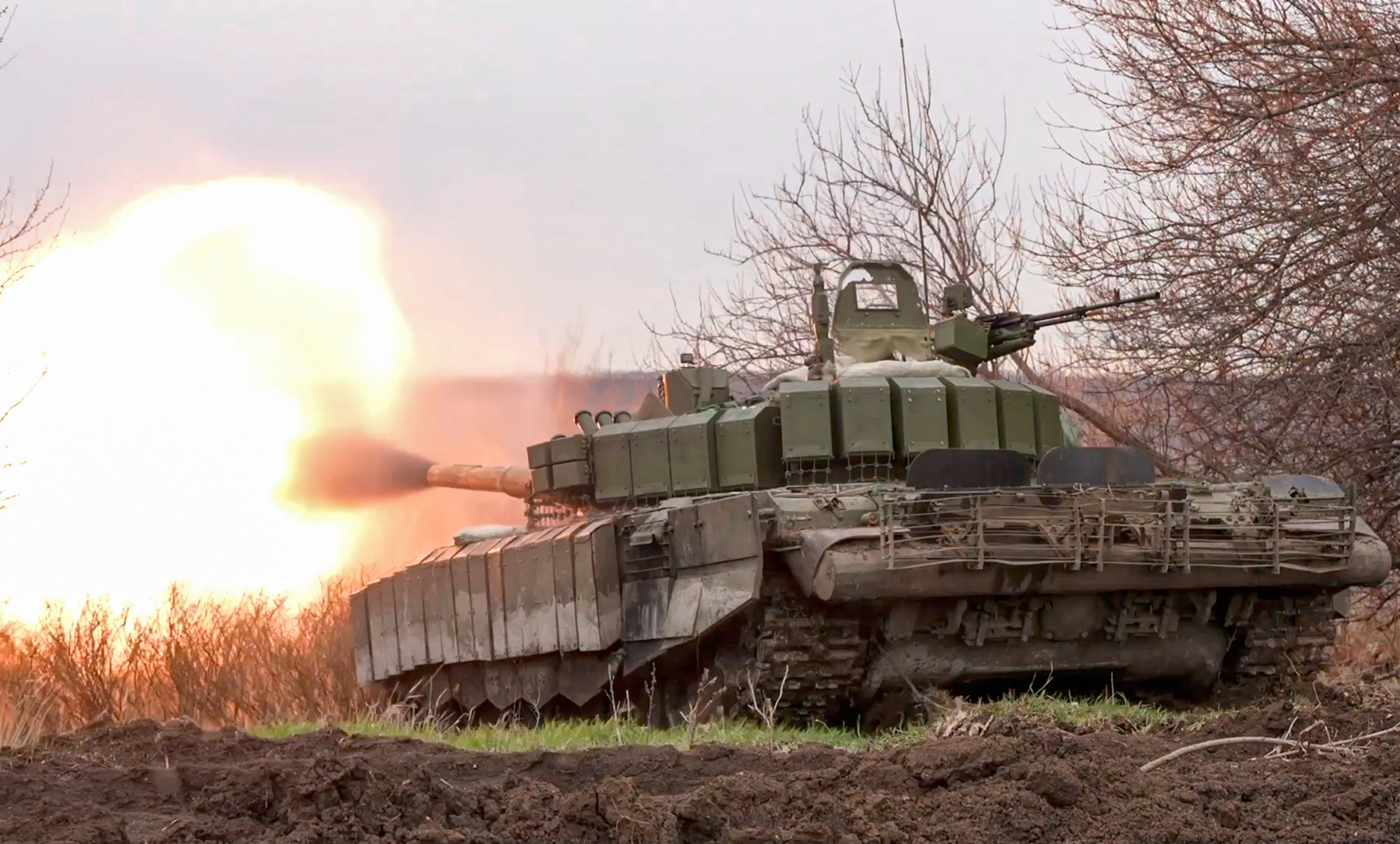 A Russian tank fires at Ukrainian positions on the front line earlier this year, in an image provided by the Russian defence ministry