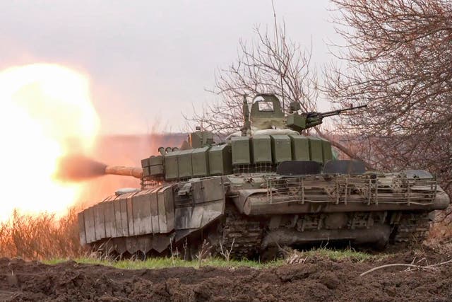 <p>A Russian tank fires at Ukrainian positions on the front line earlier this year, in an image provided by the Russian defence ministry </p>