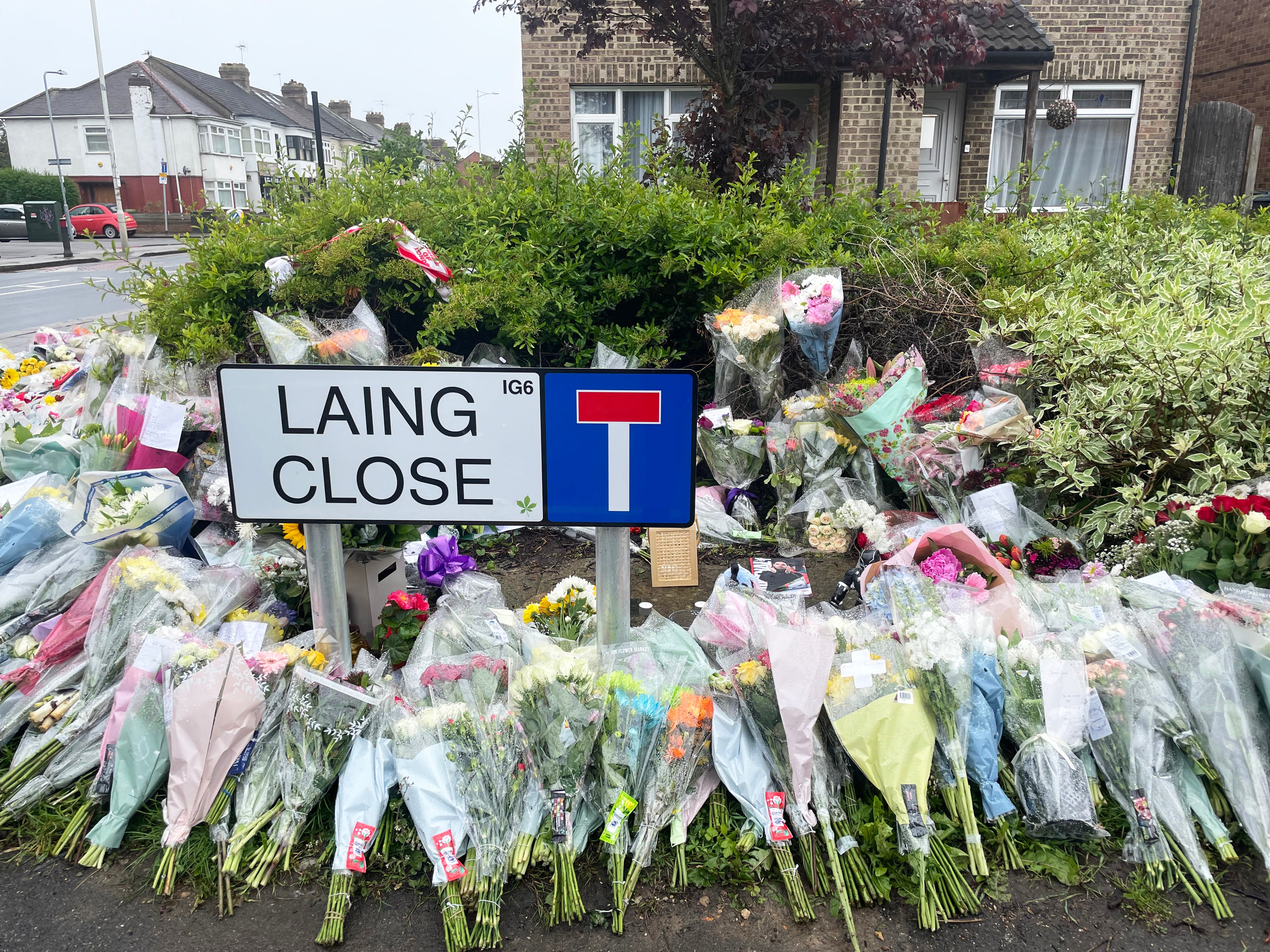 Floral tributes at the end of Laing Close near the scene in Hainault, northeast London