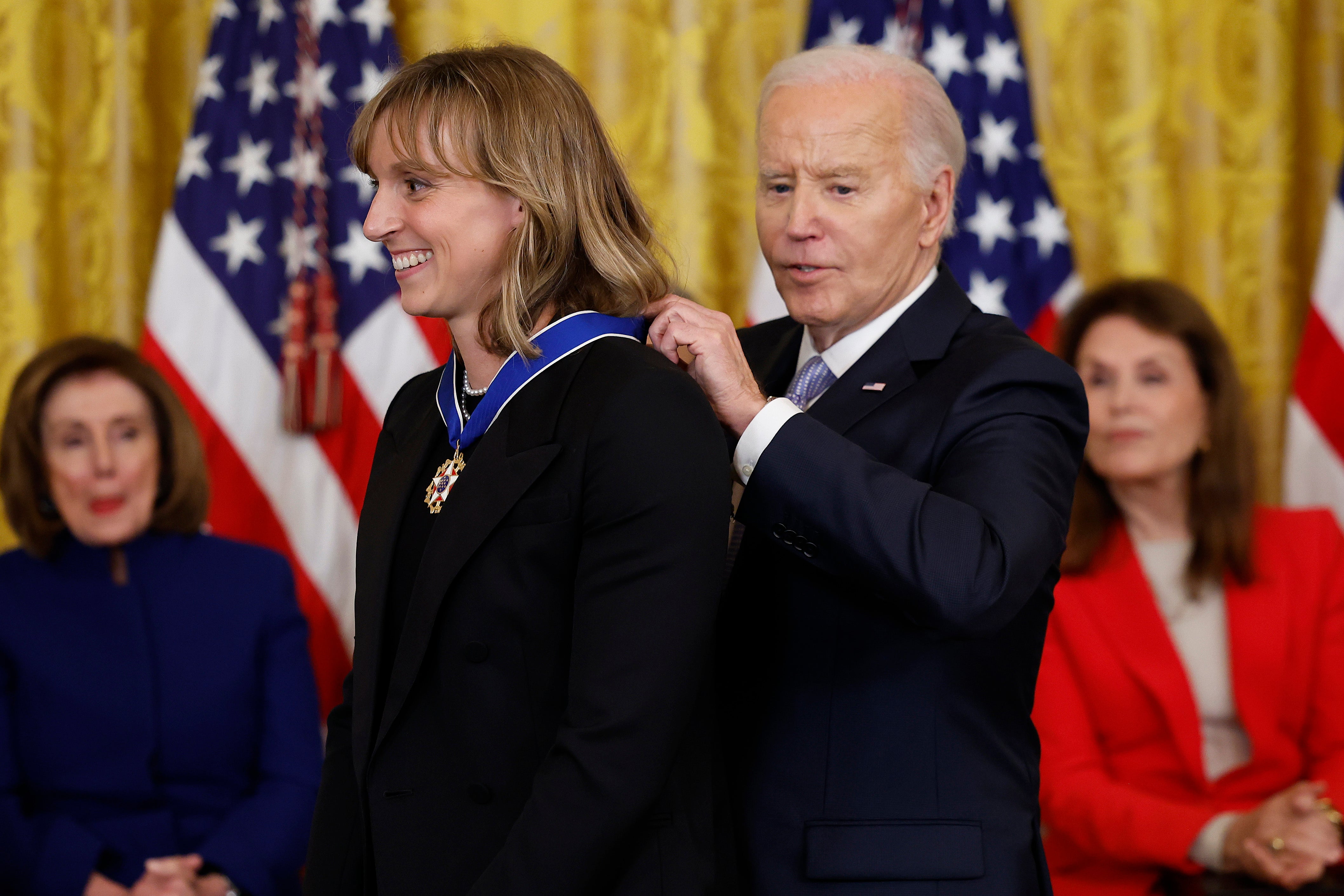 Joe Biden awards the Medal of Freedom to US Olympic gold medal swimmer Katie Ledecky during a ceremony at the White House