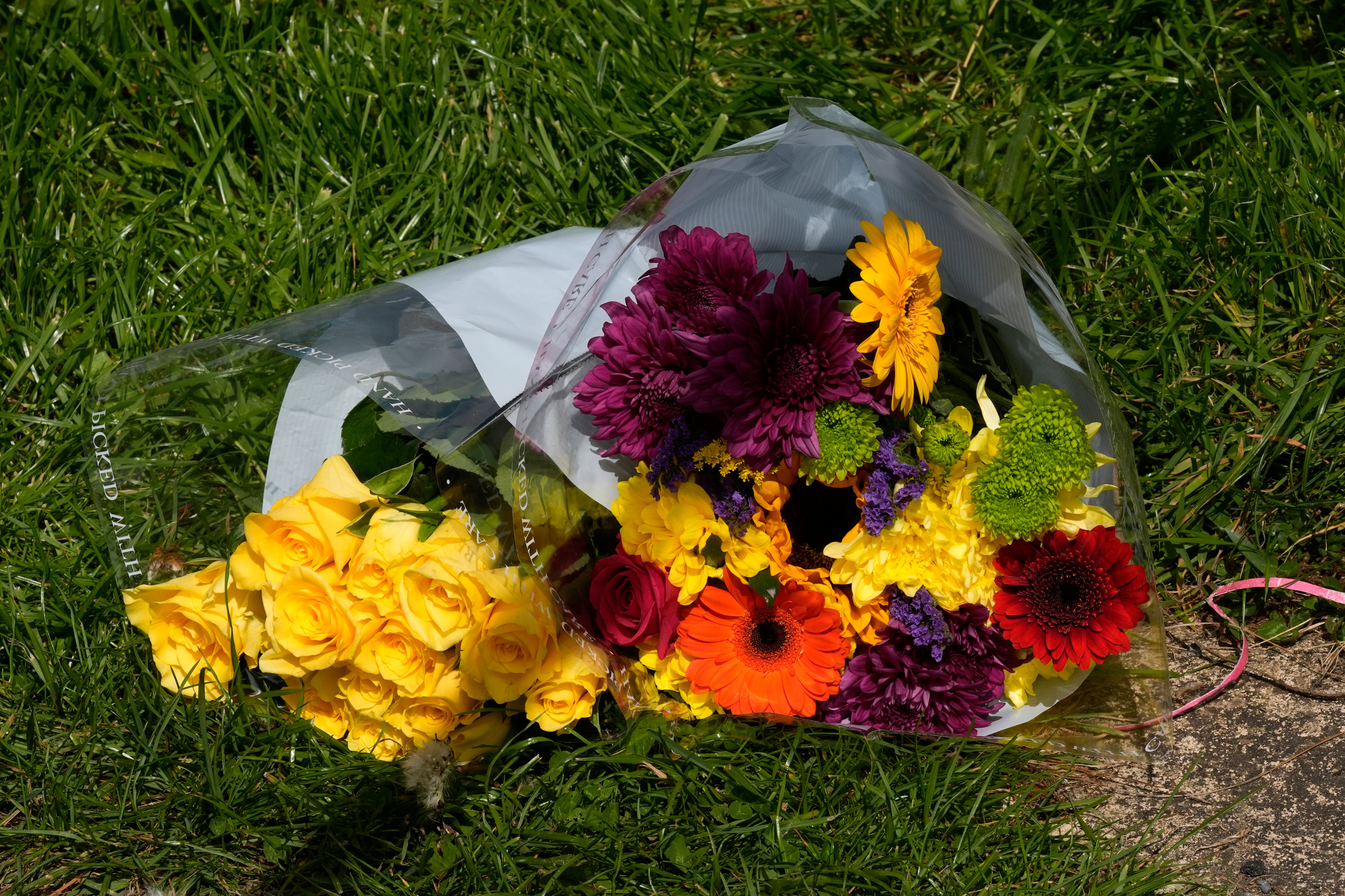 Floral tribute at the scene of a fatal house fire where a 10-year-old girl was killed